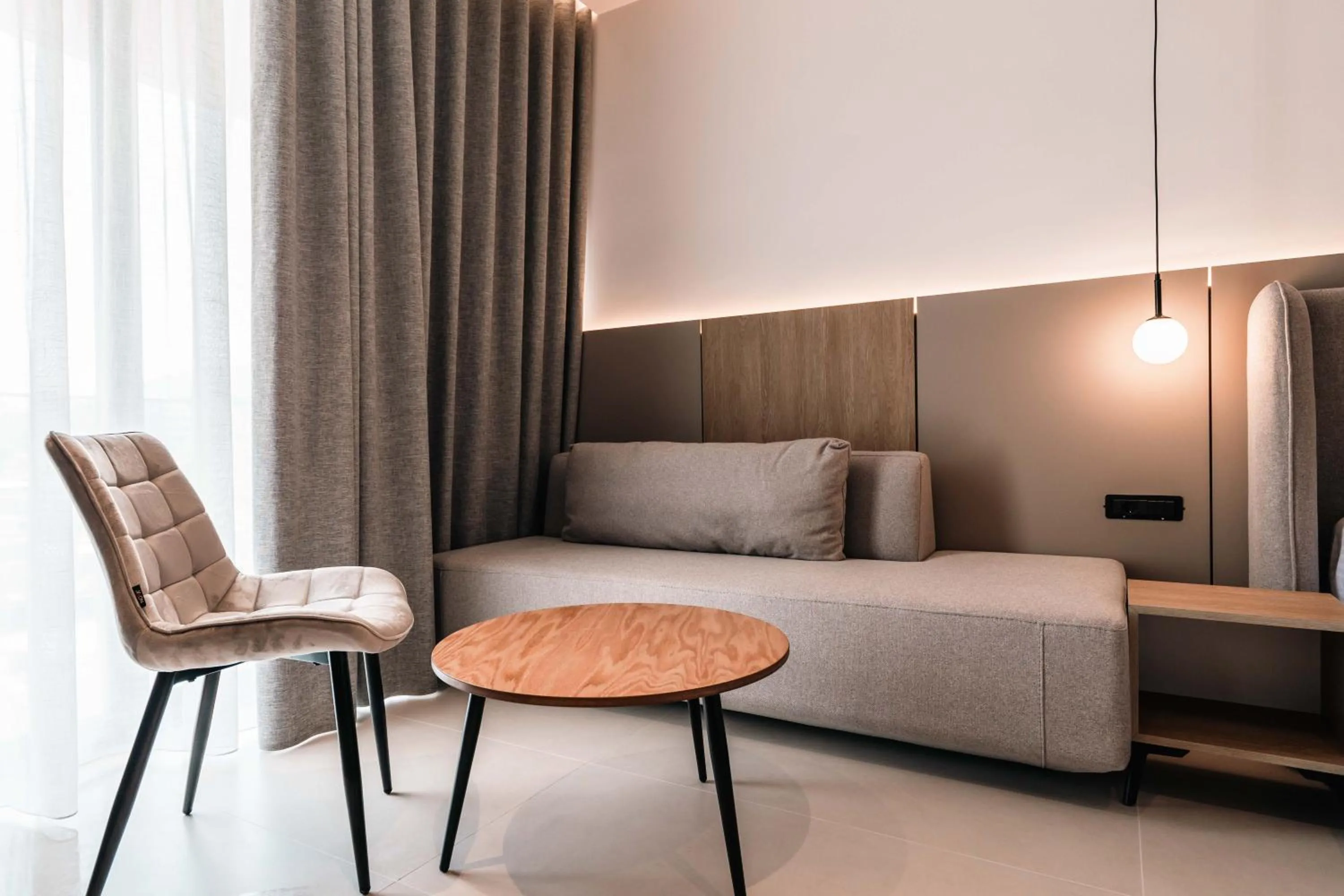 Living room, Bed in Central Park Premium Hotel