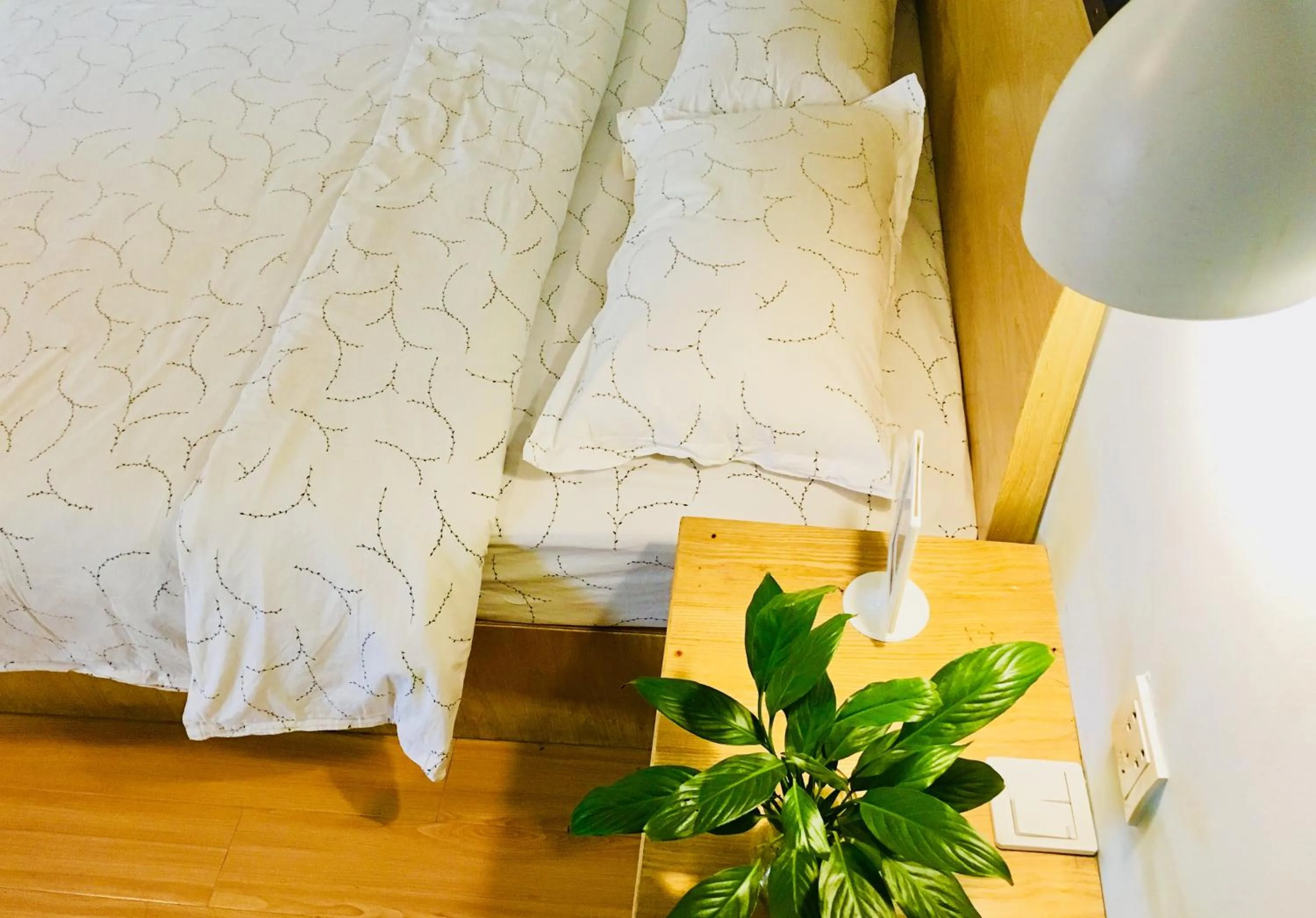 Decorative detail, Bed in Guilin Cyan Box Guest House