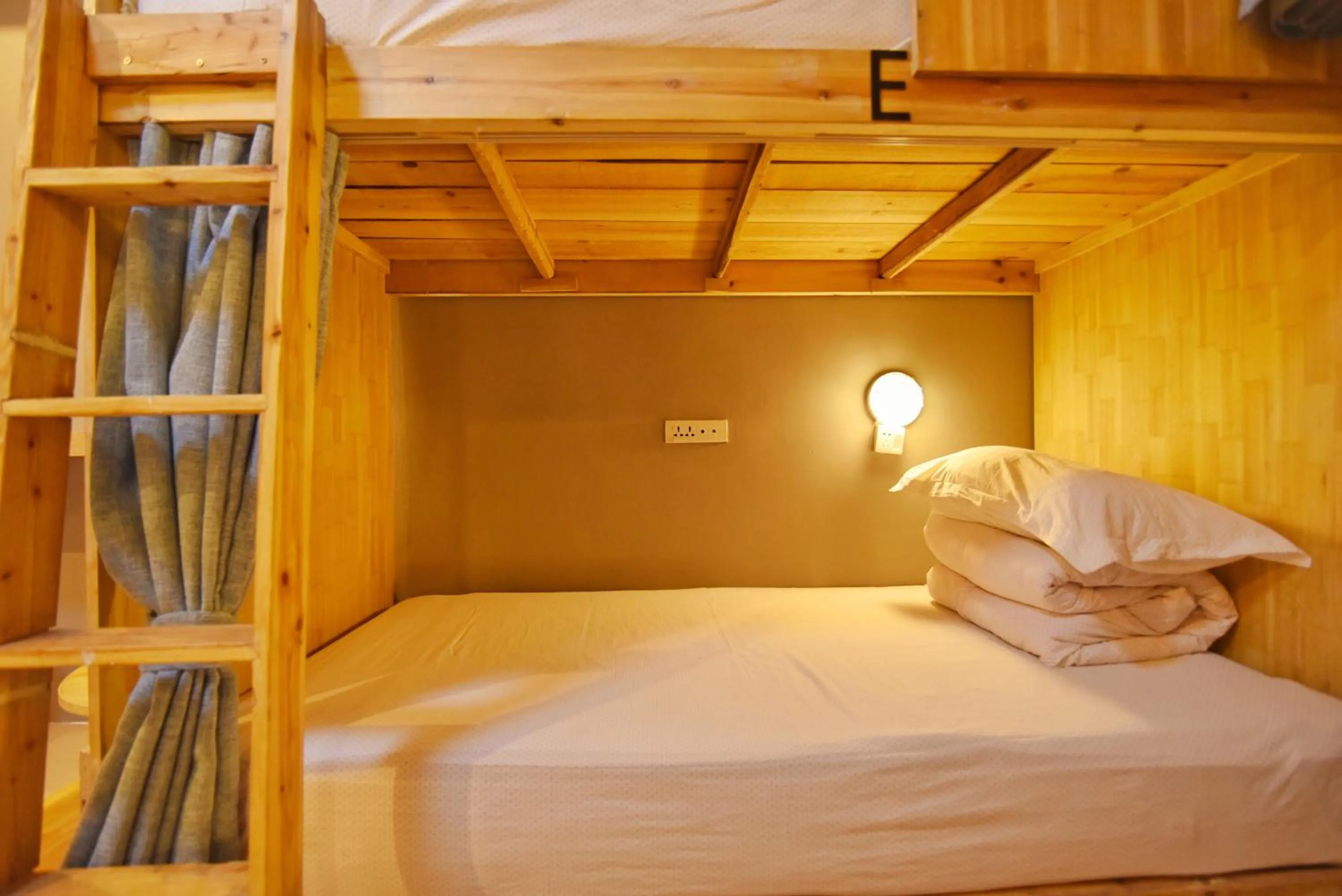 Decorative detail, Bed in Guilin Cyan Box Guest House