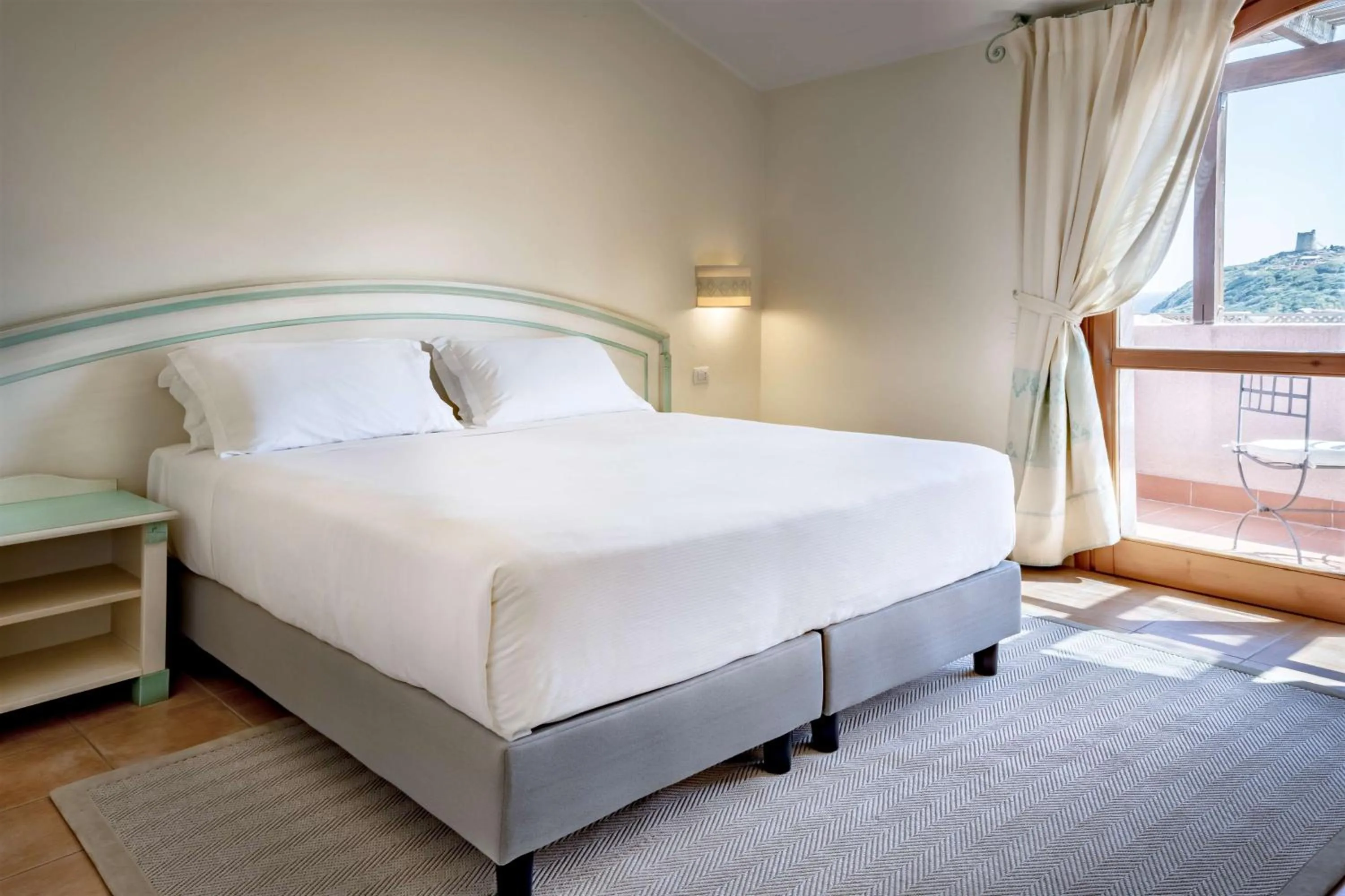 Bedroom, Bed in Veridia Resort Sardinia, a member of Radisson Individuals