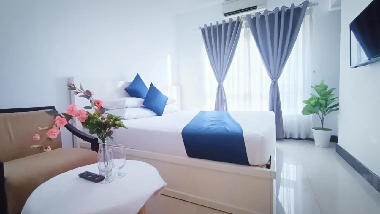 Bed in Queen Central Apartment Hotel