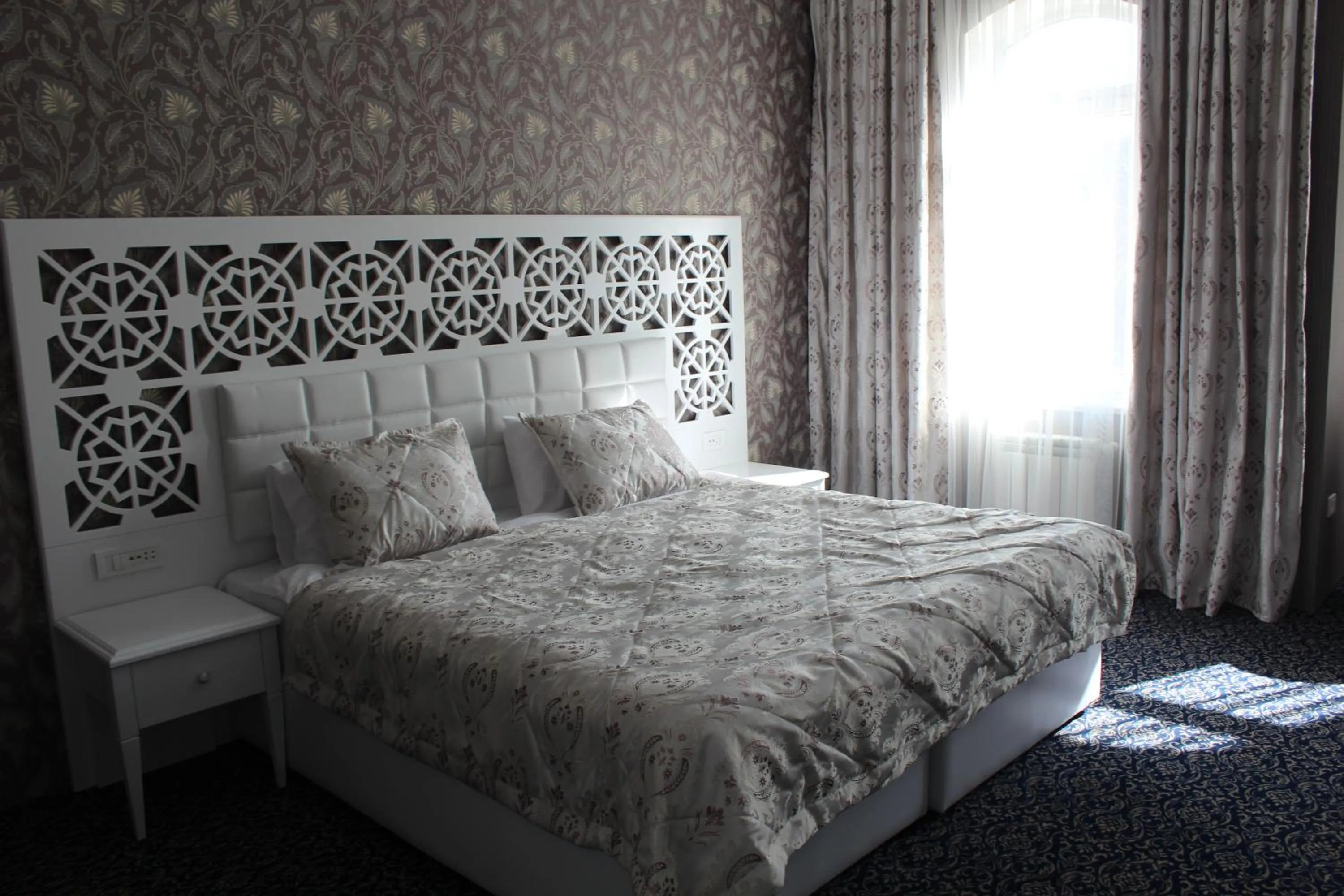 Bed in Premier Old Gates Hotel