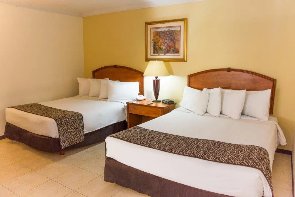 Bed in Hafersons Inn Hotel Suites