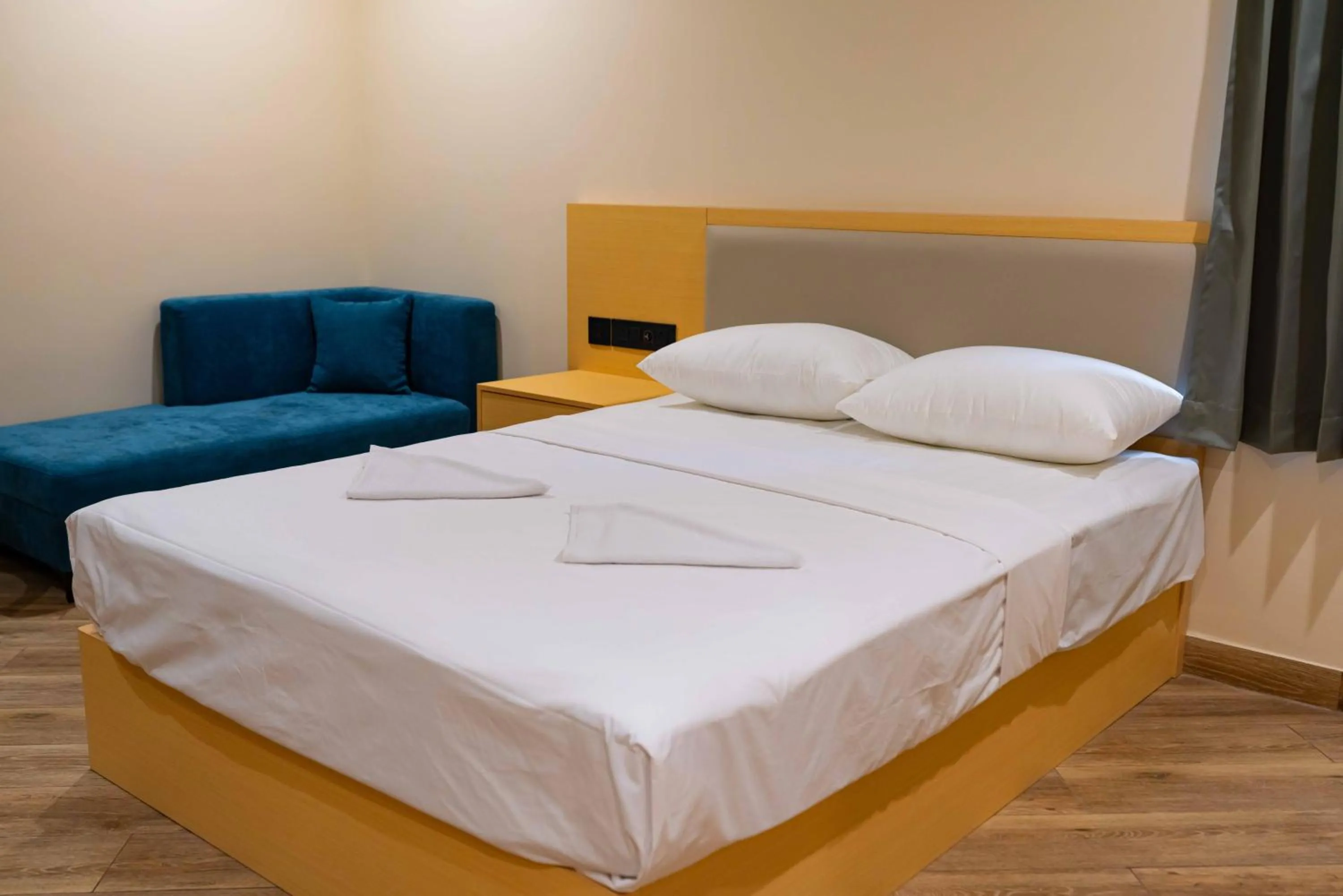 Bed in The Paradise International Hotel