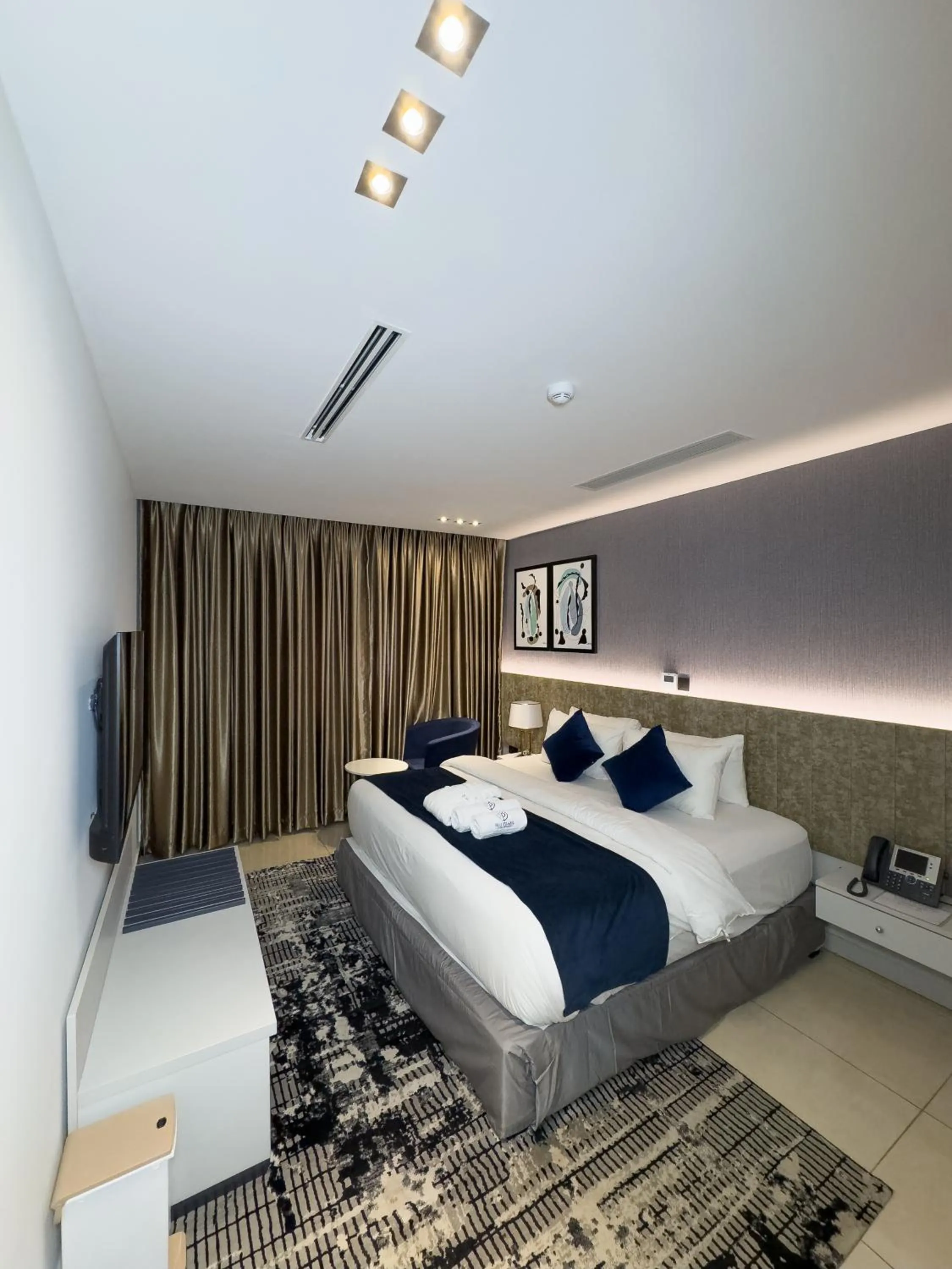 Bed in Blu Pearl Hotel & Residence