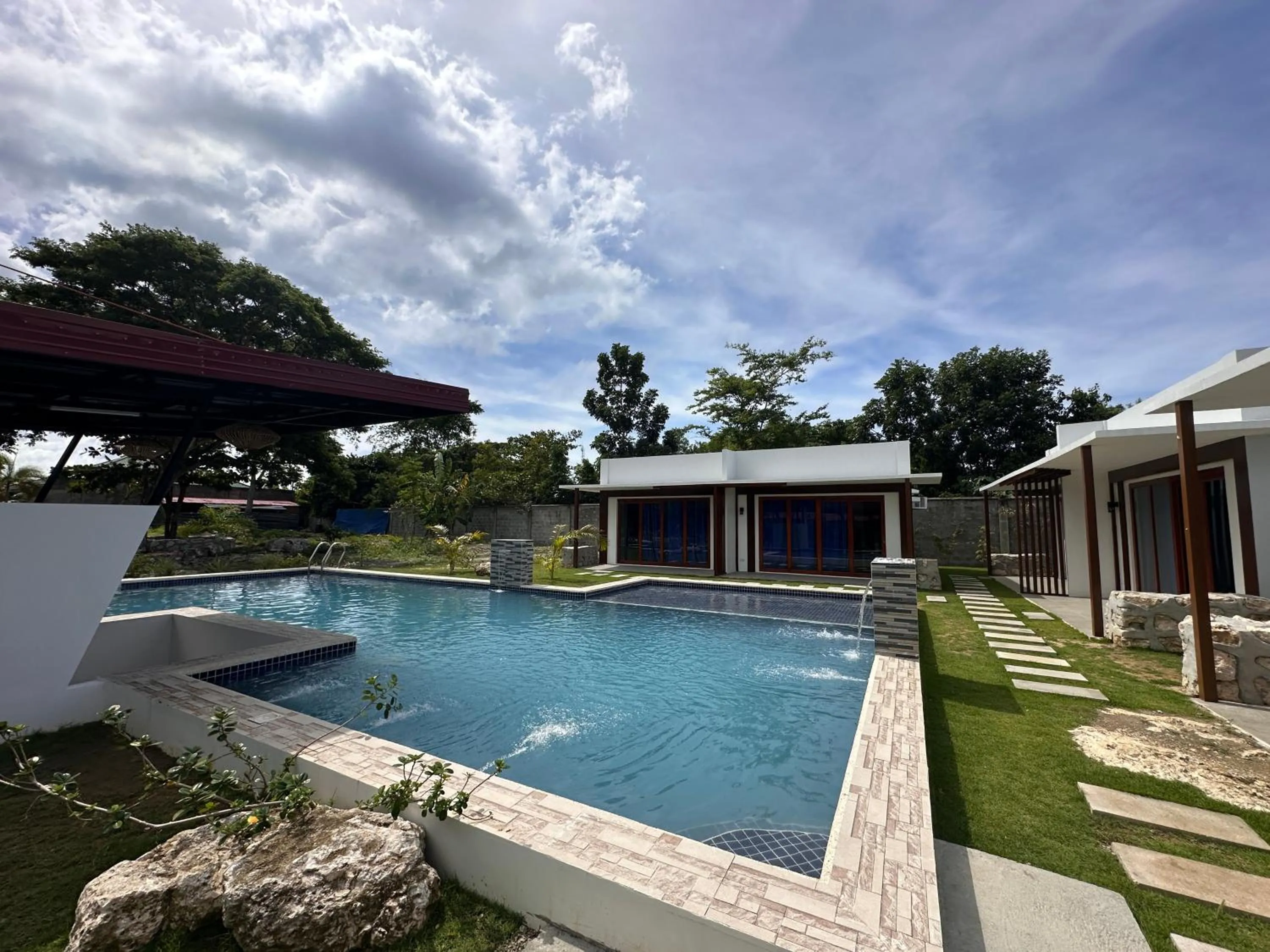 Swimming pool in Bluewaves Hostel & Villa Panagsama by Hiverooms