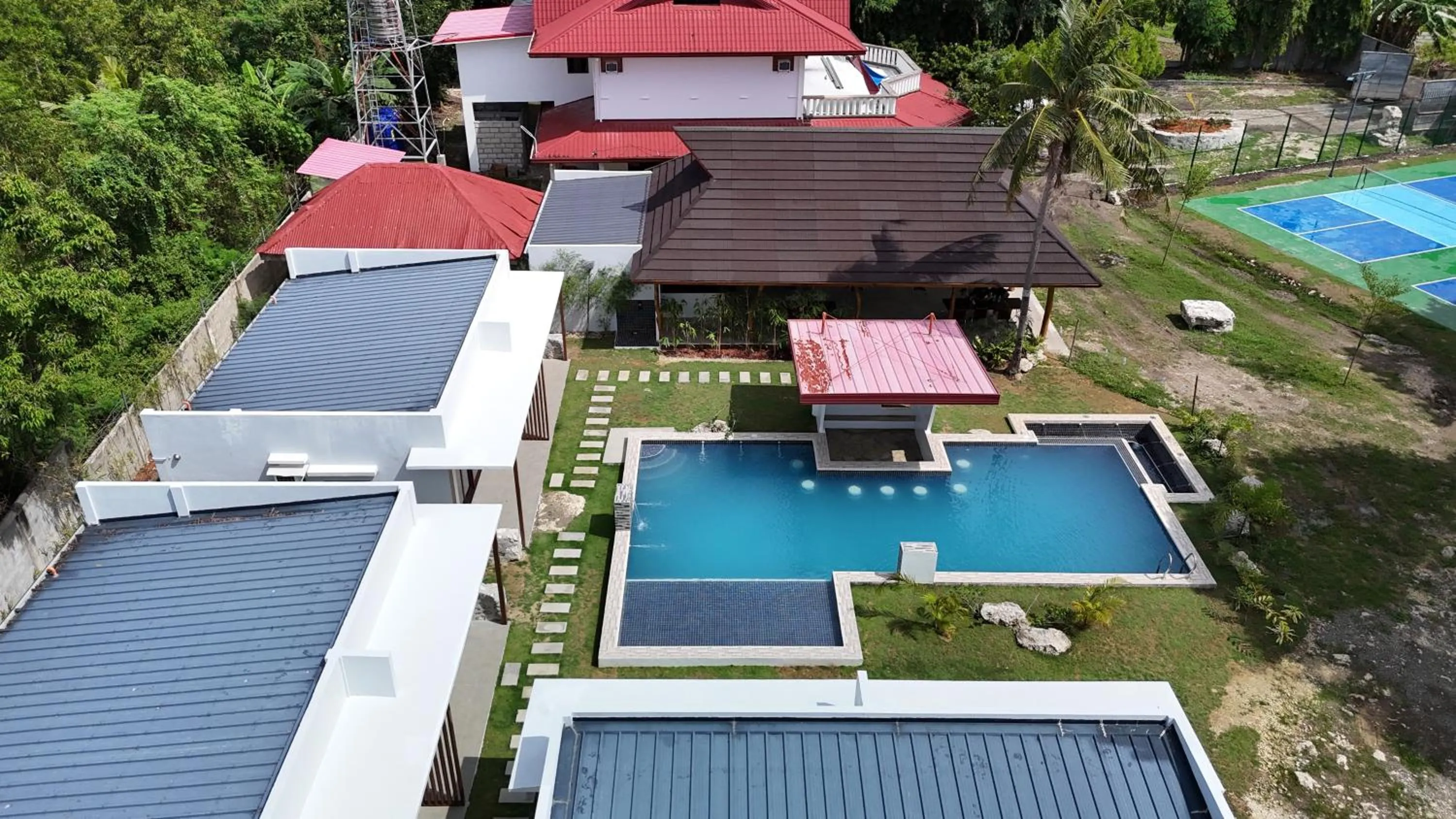 Property building in Bluewaves Hostel & Villa Panagsama by Hiverooms