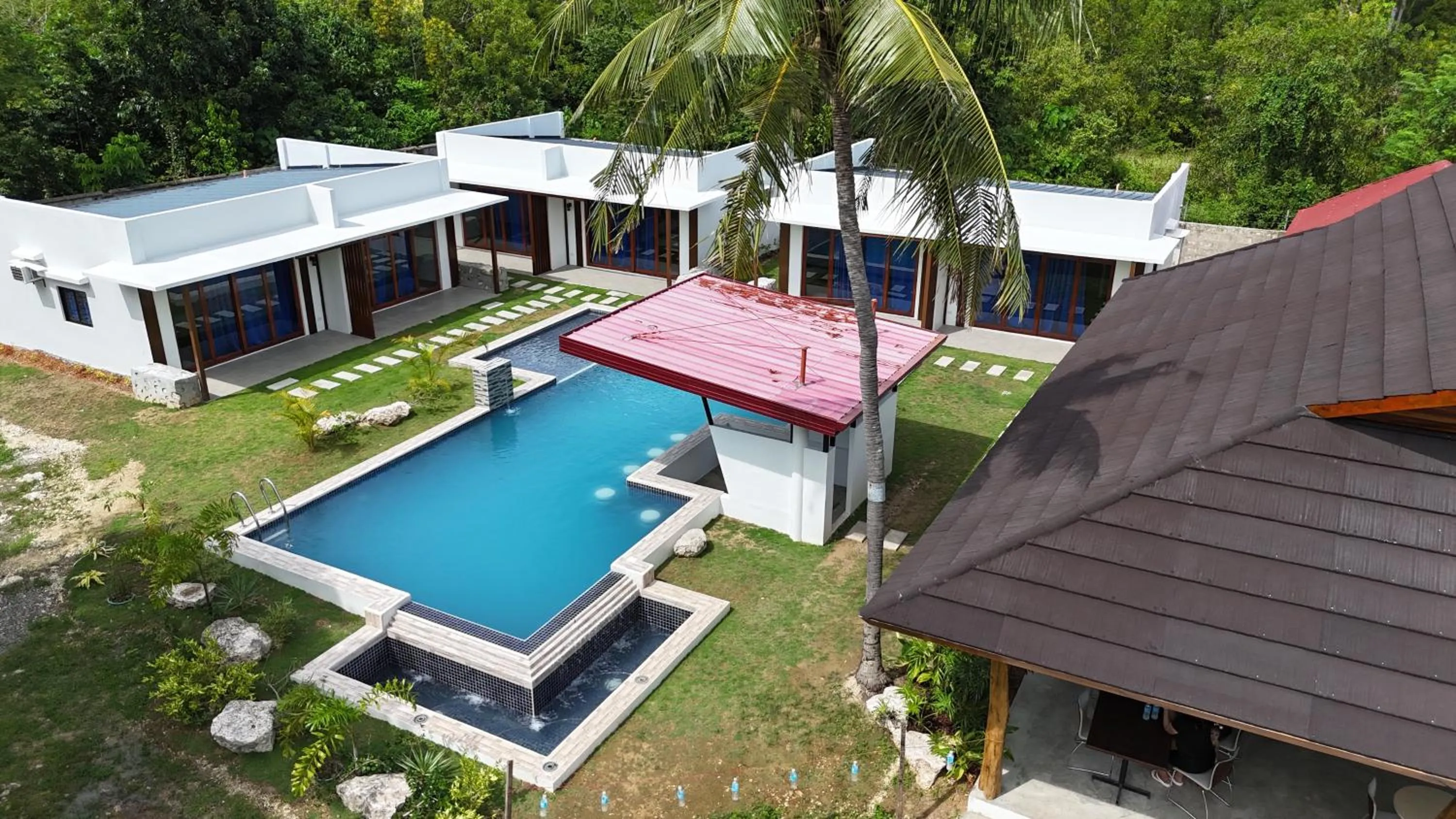 Property building in Bluewaves Hostel & Villa Panagsama by Hiverooms