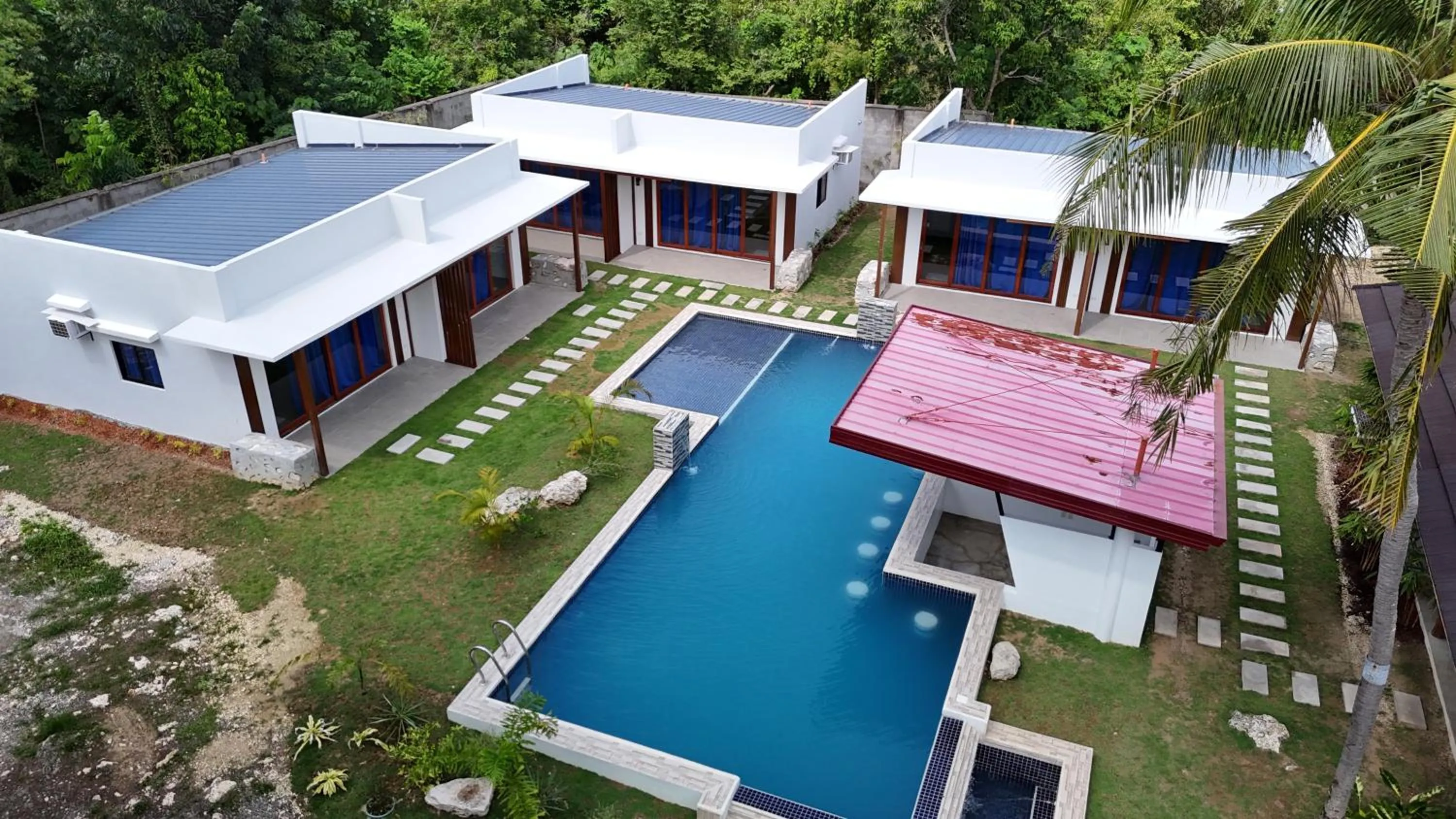 Property building in Bluewaves Hostel & Villa Panagsama by Hiverooms