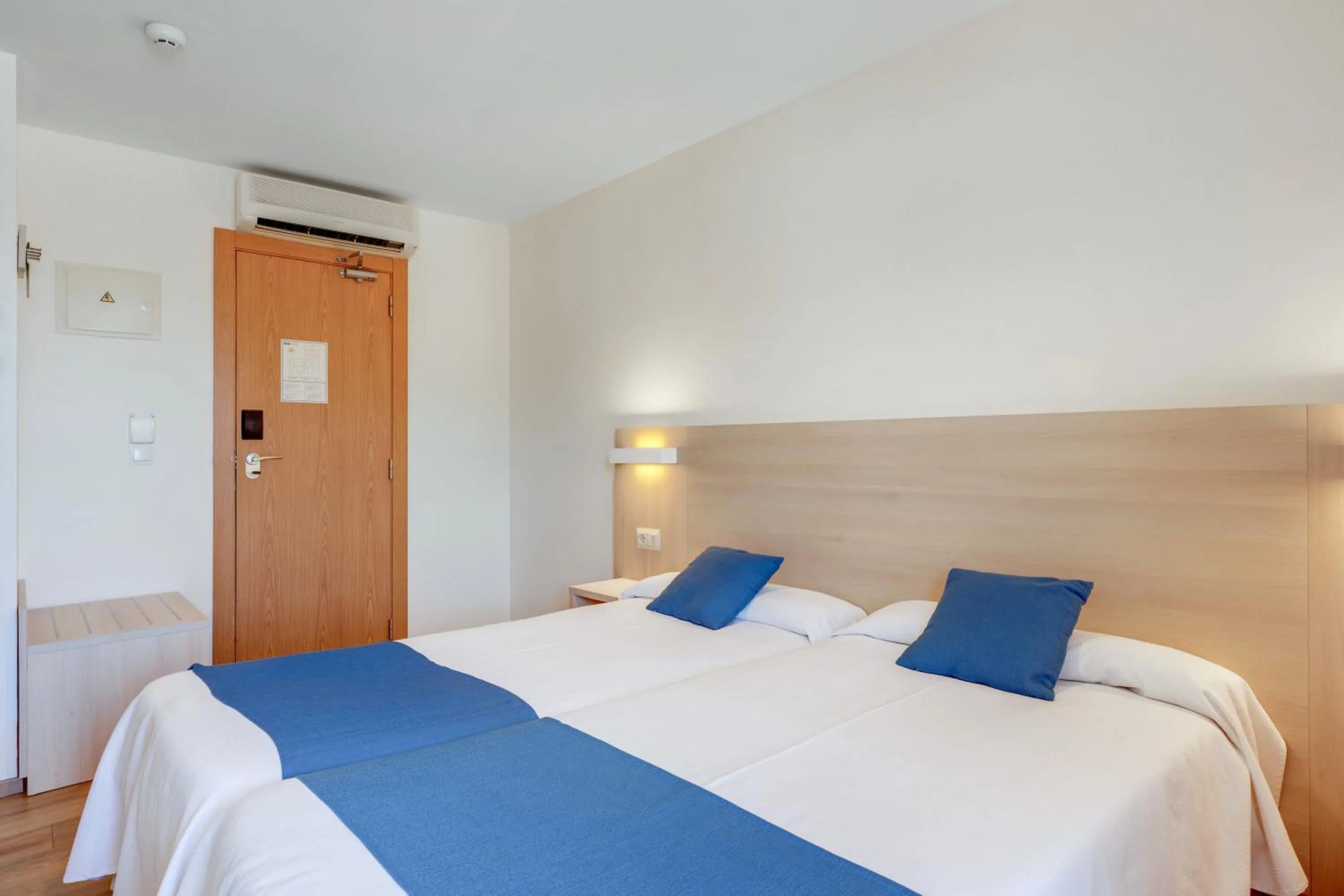 Bed in Bluewater Hotel