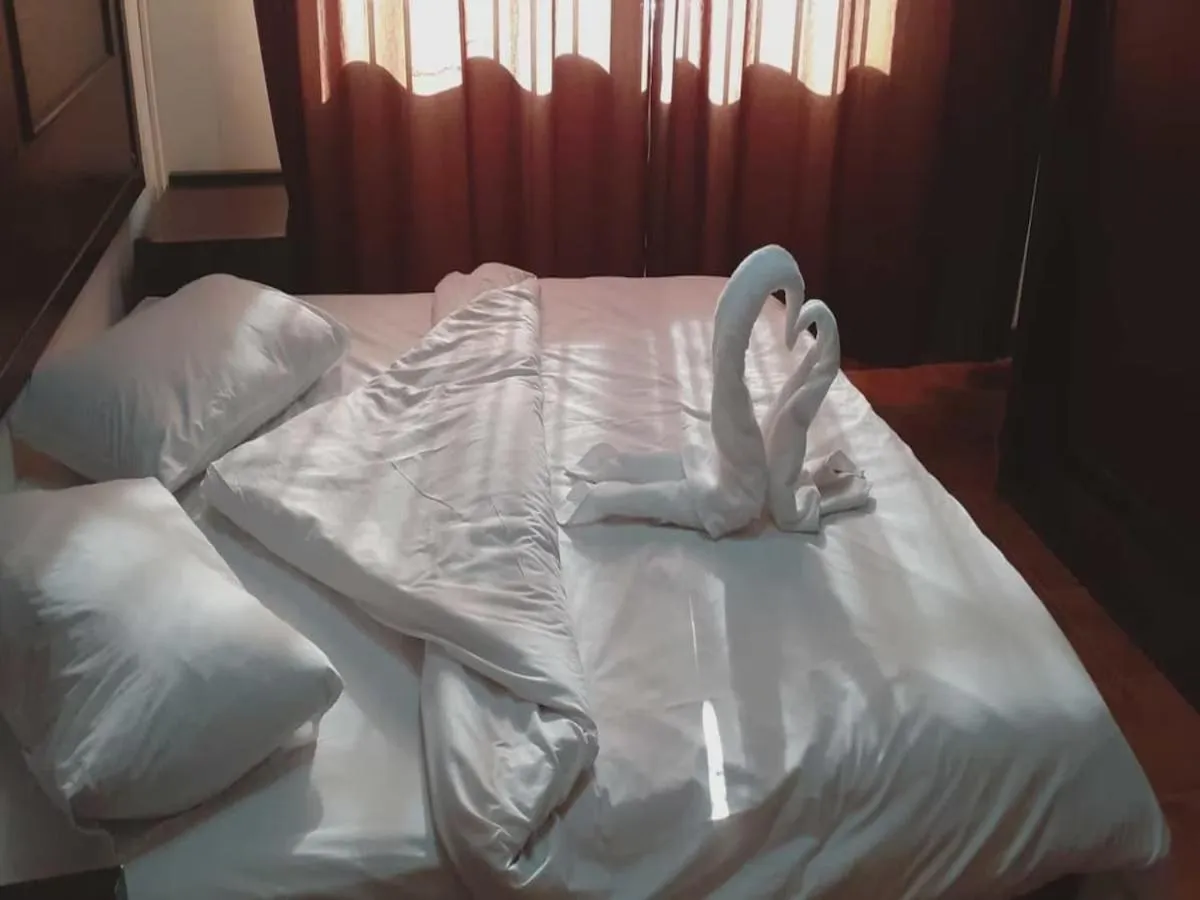 Bed in Al-Nujoom Hotel Suites