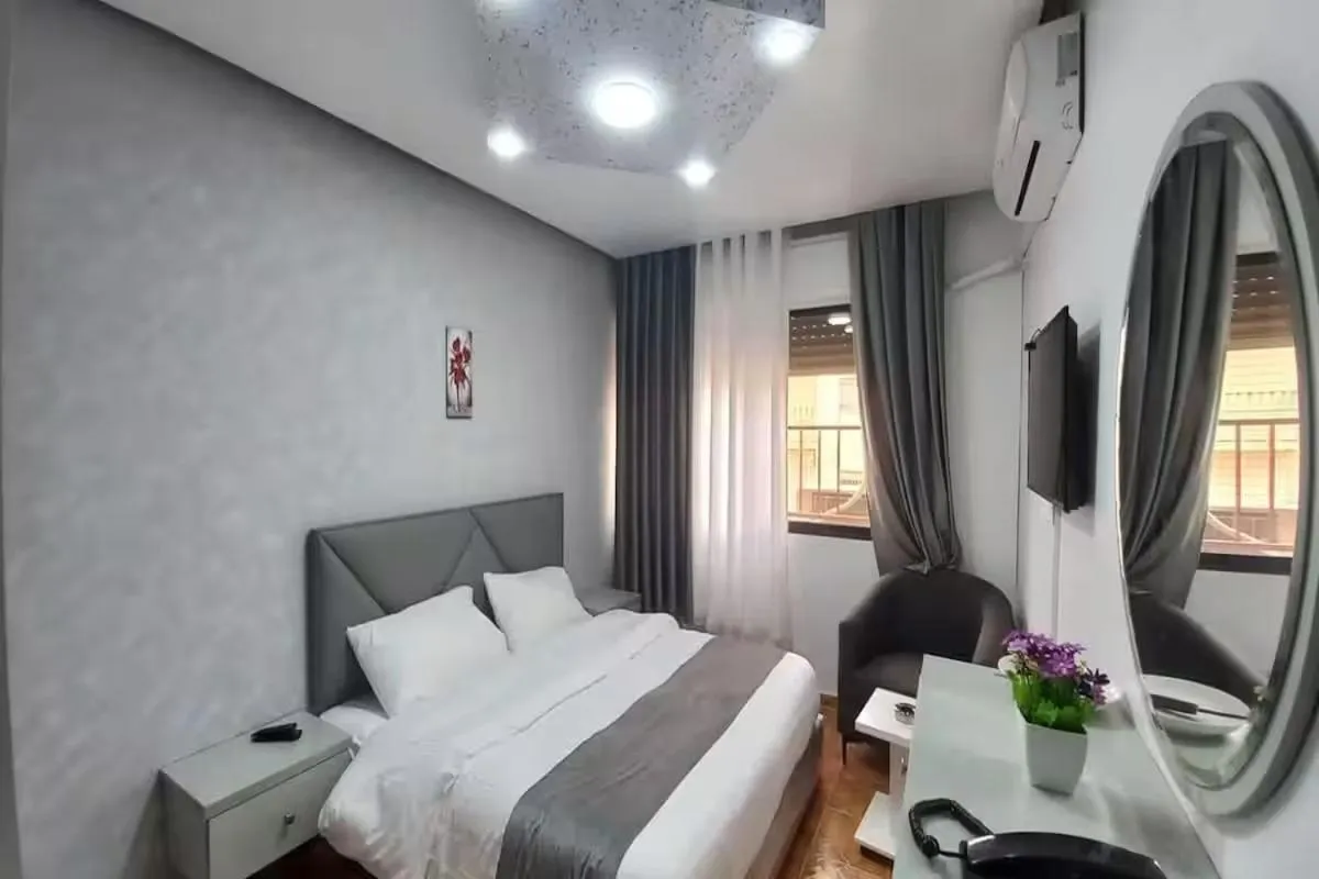 Bed in Al-Nujoom Hotel Suites