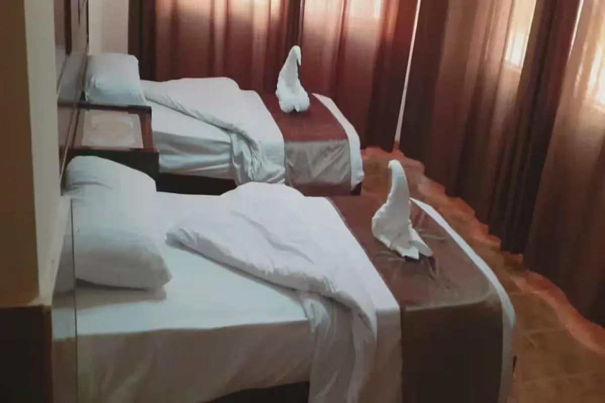 Bed in Al-Nujoom Hotel Suites