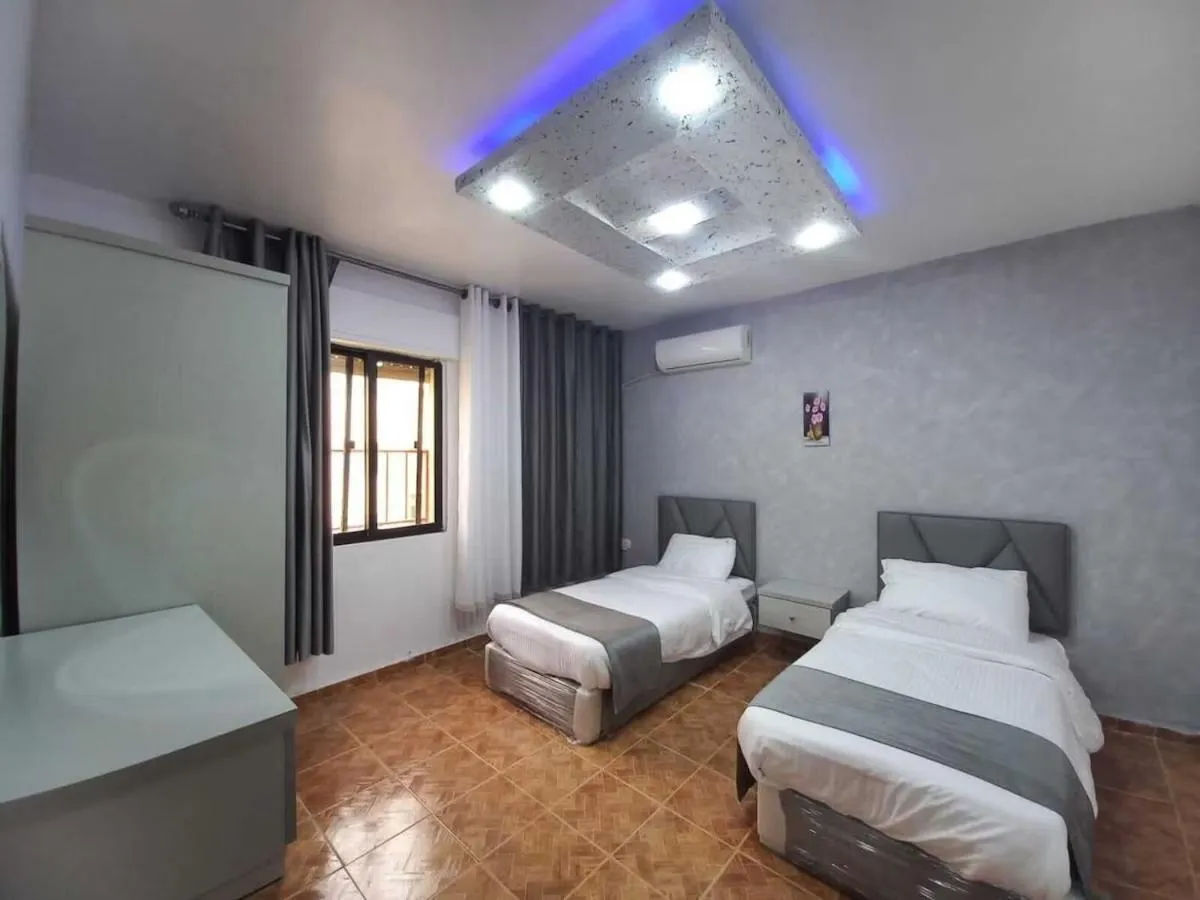 Bed in Al-Nujoom Hotel Suites