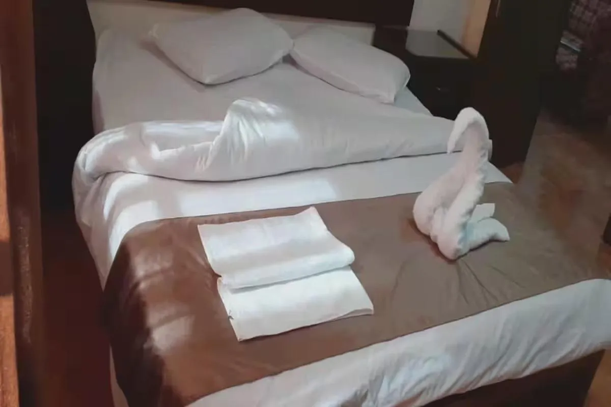 Bed in Al-Nujoom Hotel Suites