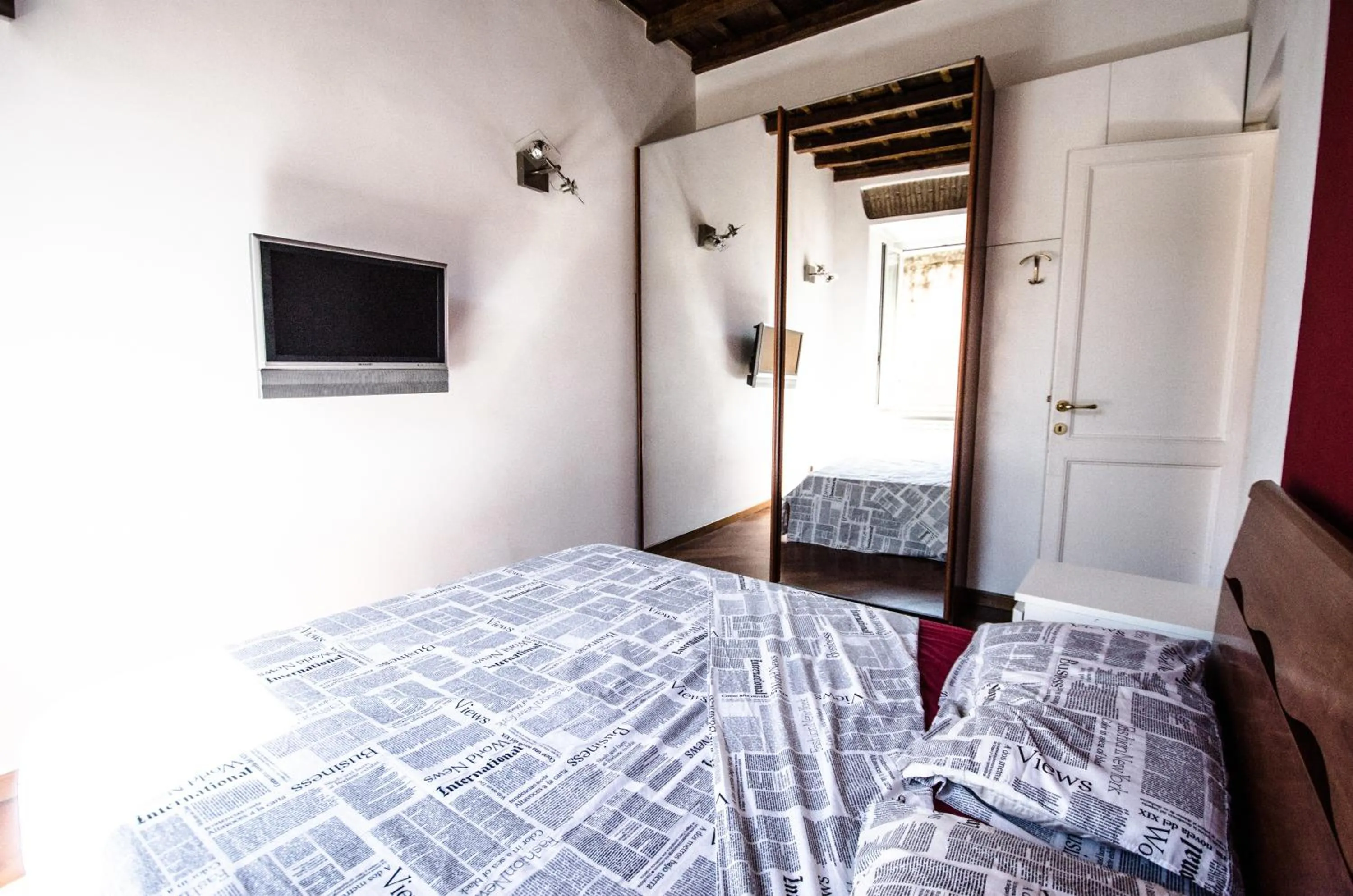 Photo of the whole room, Bed in Scent Of Trastevere