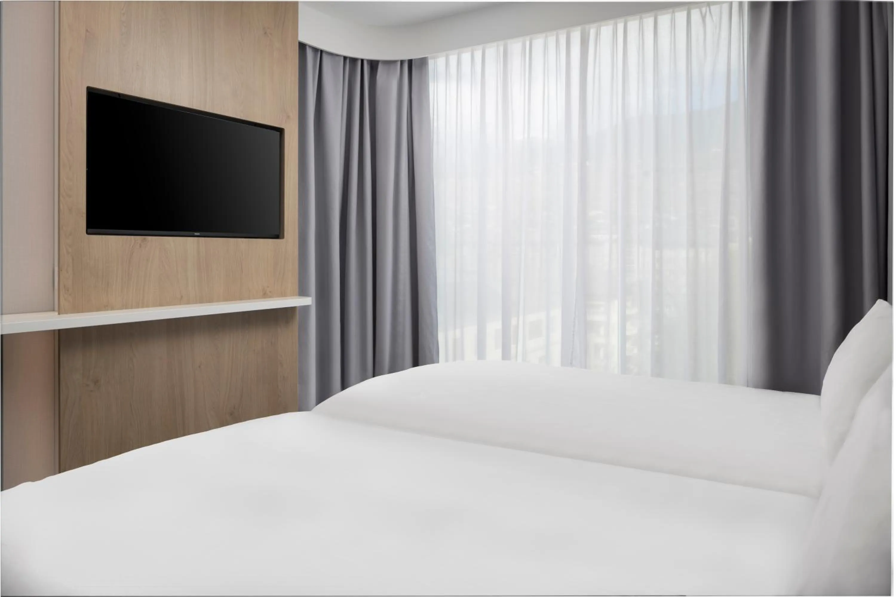 Bed in Holiday Inn Express & Suites Sion by IHG