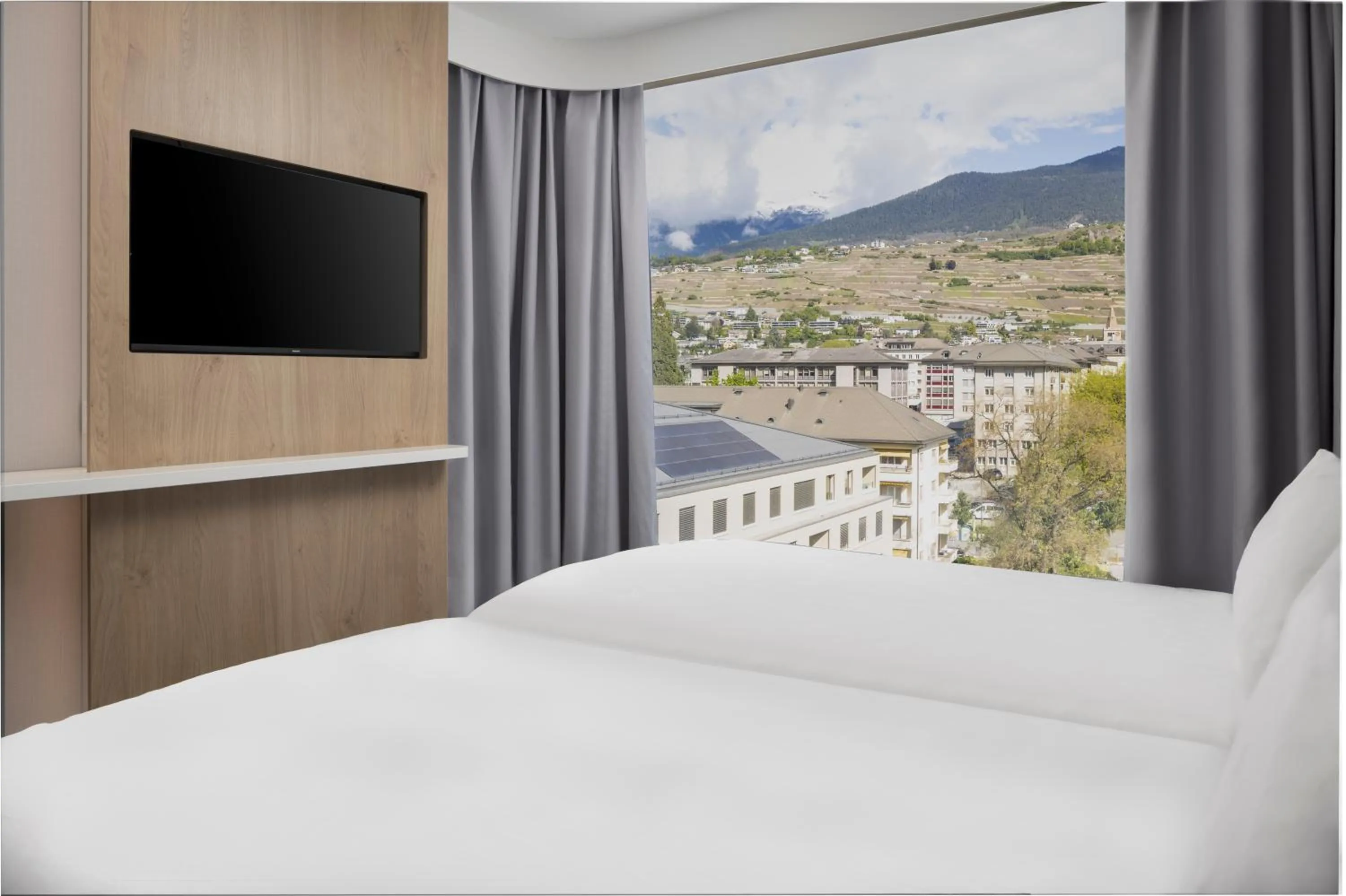 Bed in Holiday Inn Express & Suites Sion by IHG