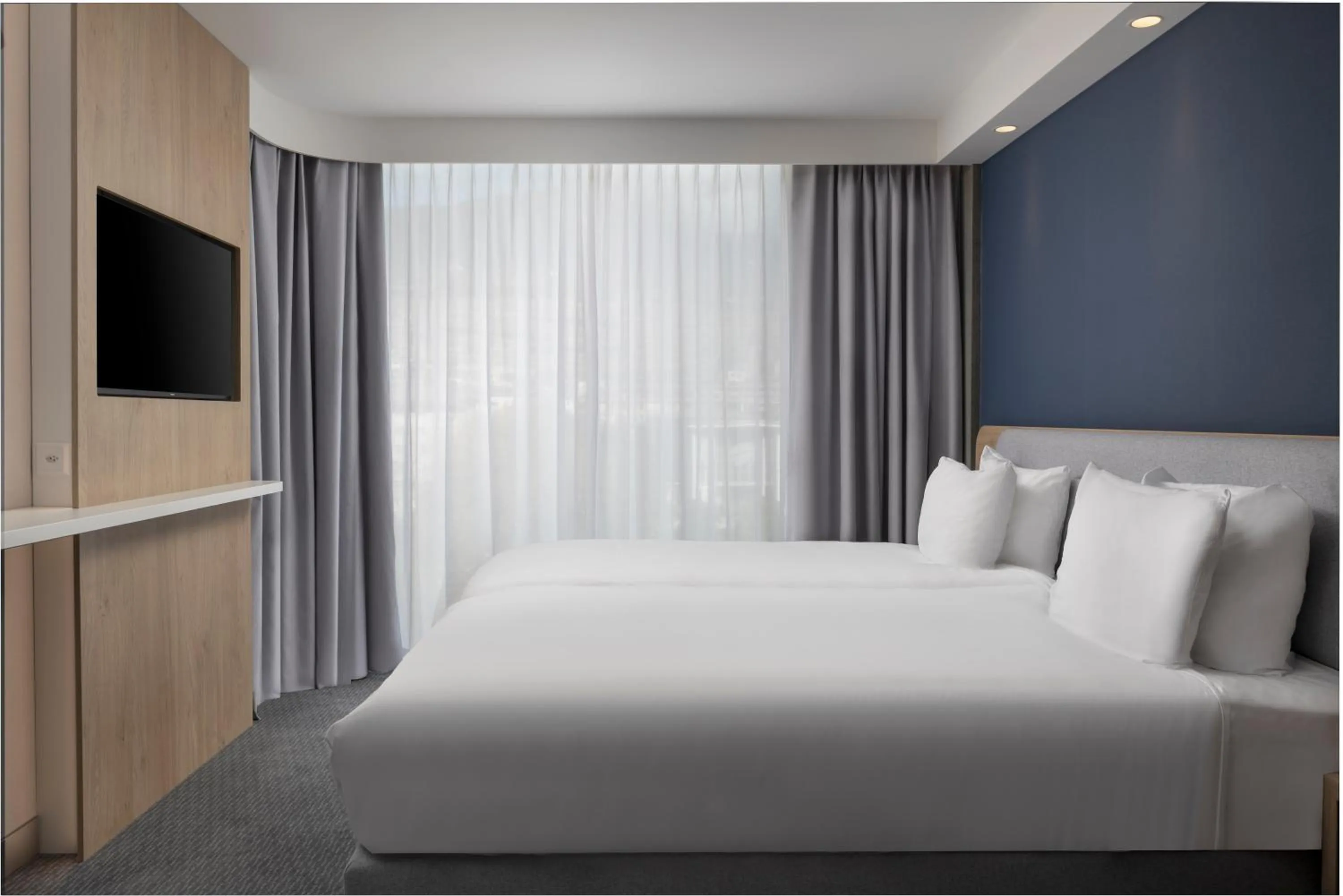 Bed in Holiday Inn Express & Suites Sion by IHG