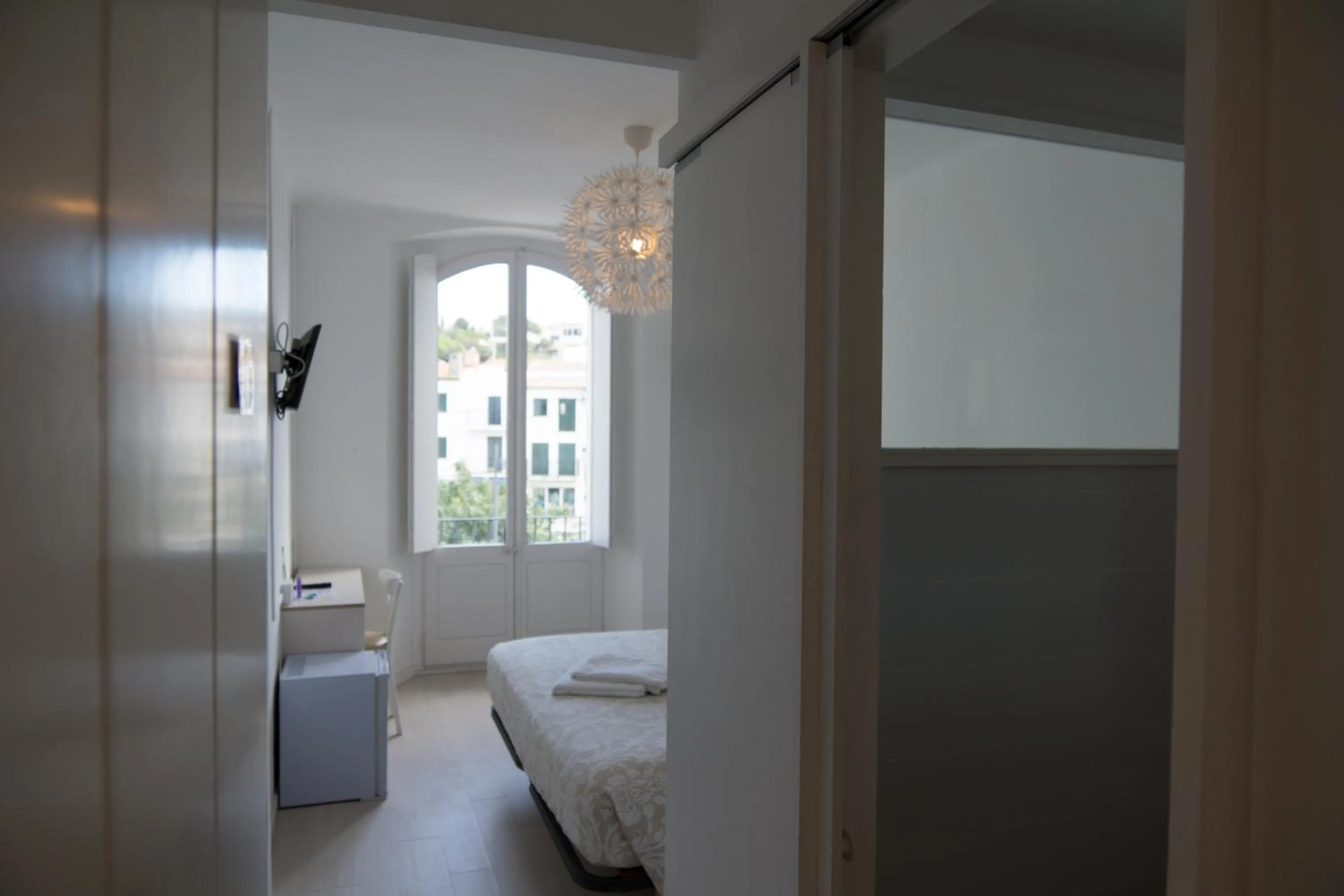 Photo of the whole room, Bed in Hostal Marina Cadaqués