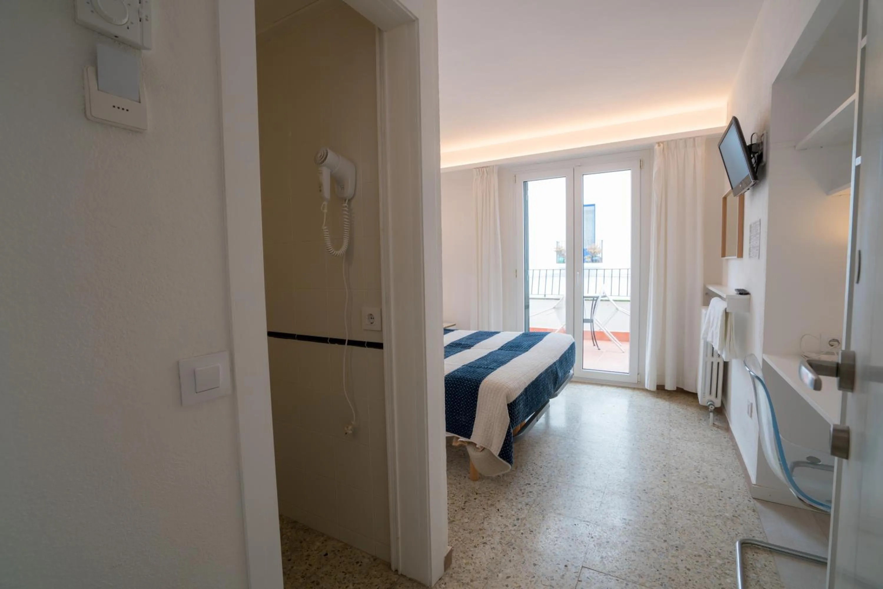 Photo of the whole room, Bed in Hostal Marina Cadaqués
