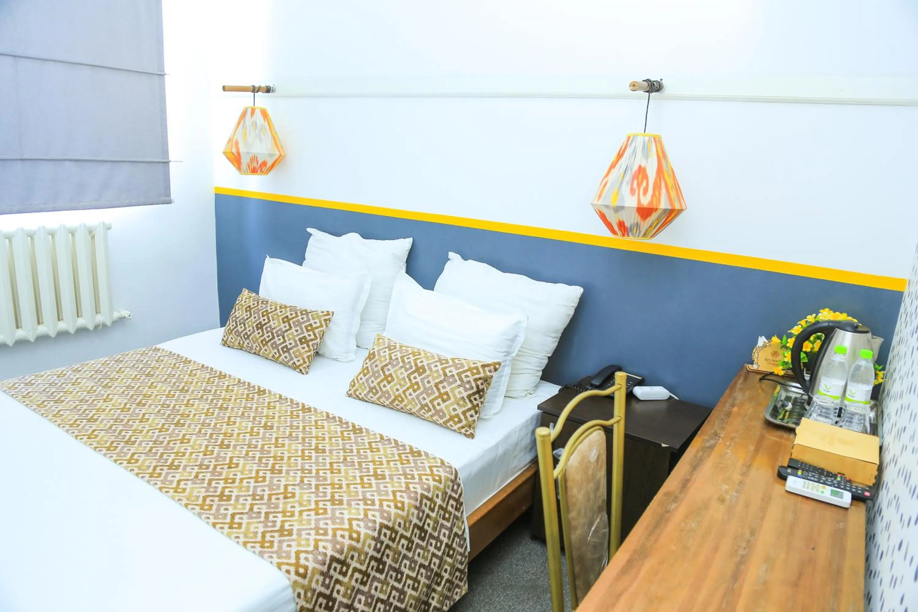 Bed in ART SAMARQAND hotel