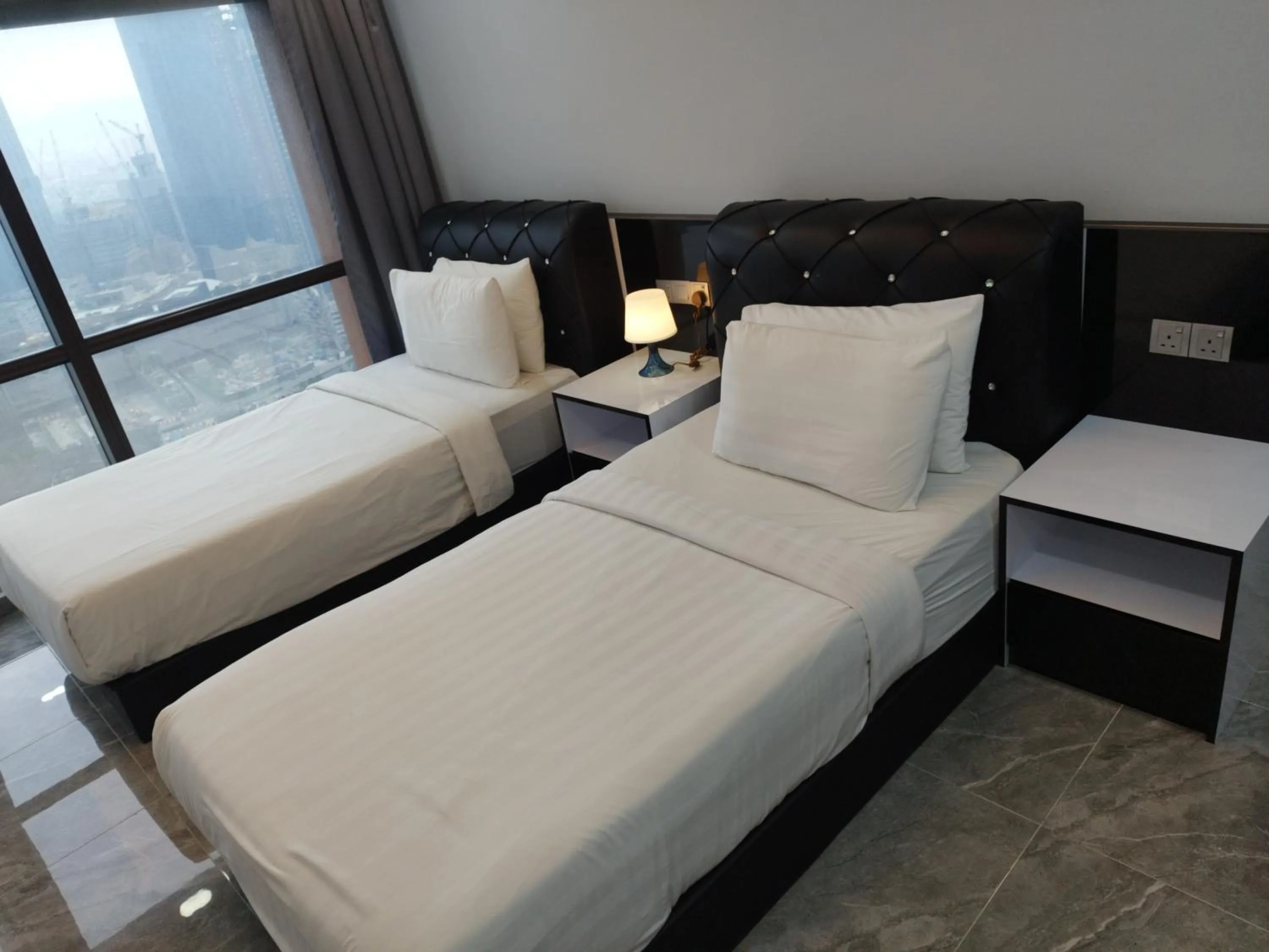 Bed in Eastern Suites Times Square KL