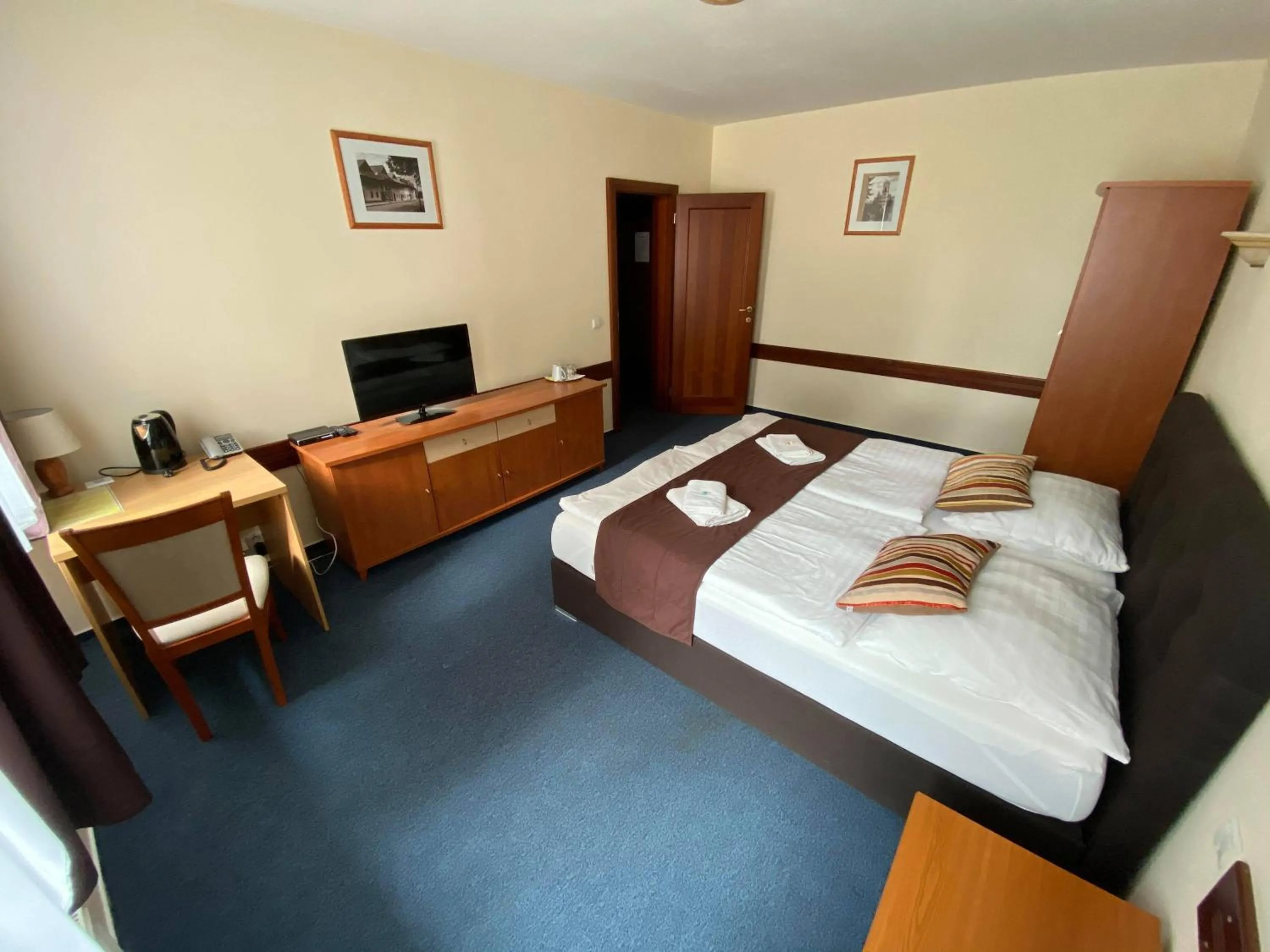 Bed in Garni Hotel Tatramonti
