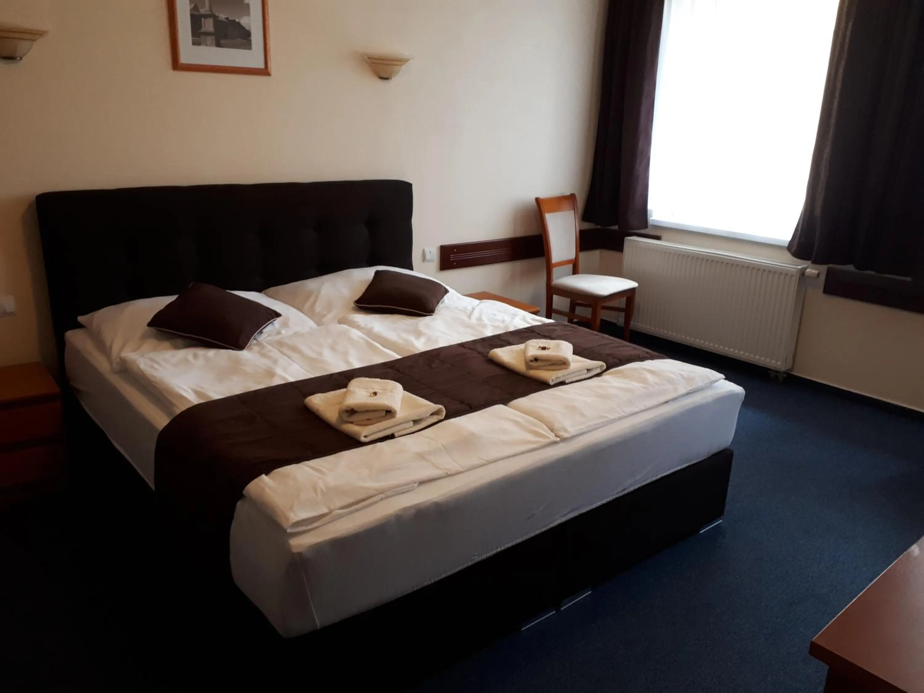 Bed in Garni Hotel Tatramonti