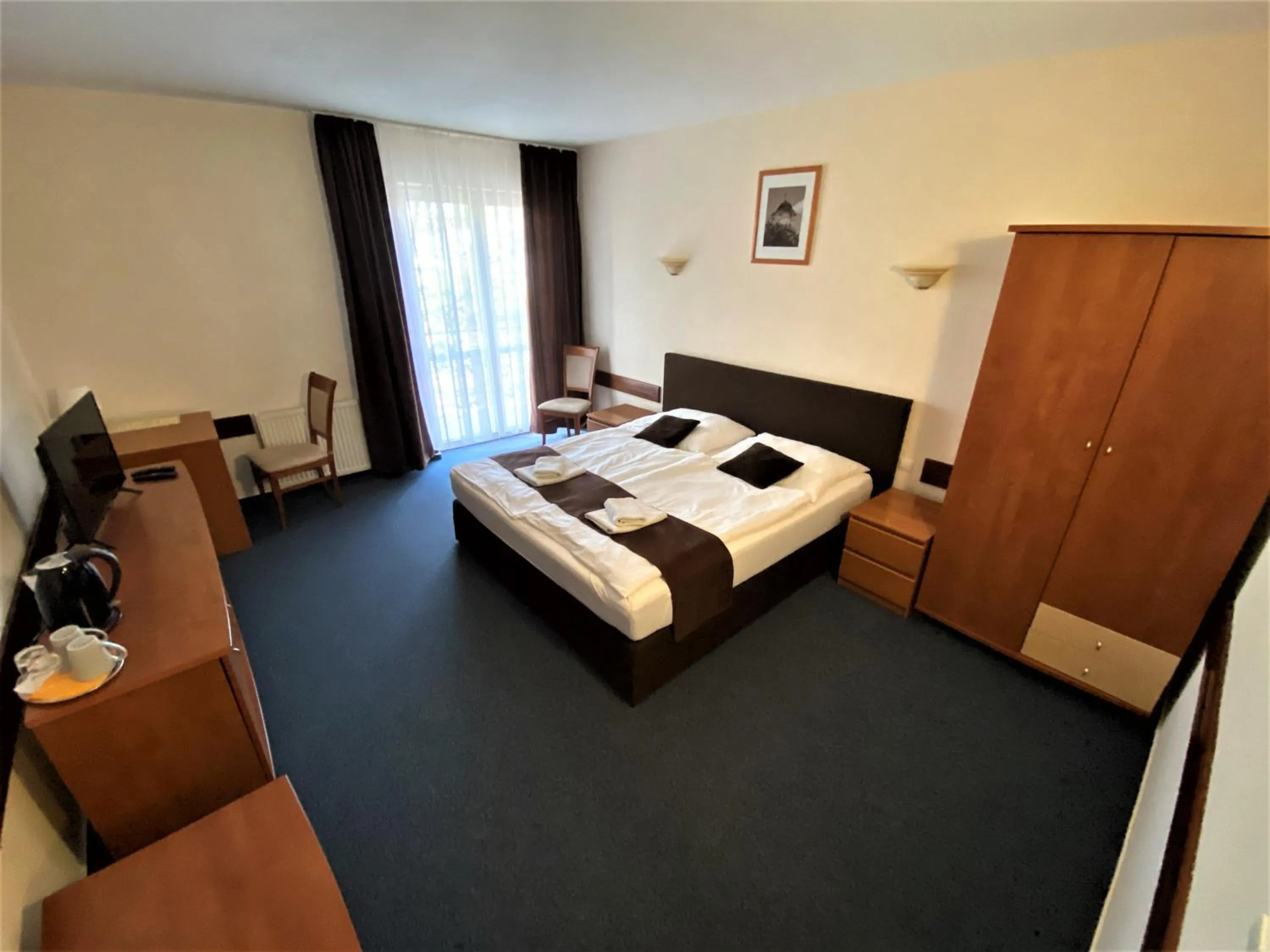 Bed in Garni Hotel Tatramonti