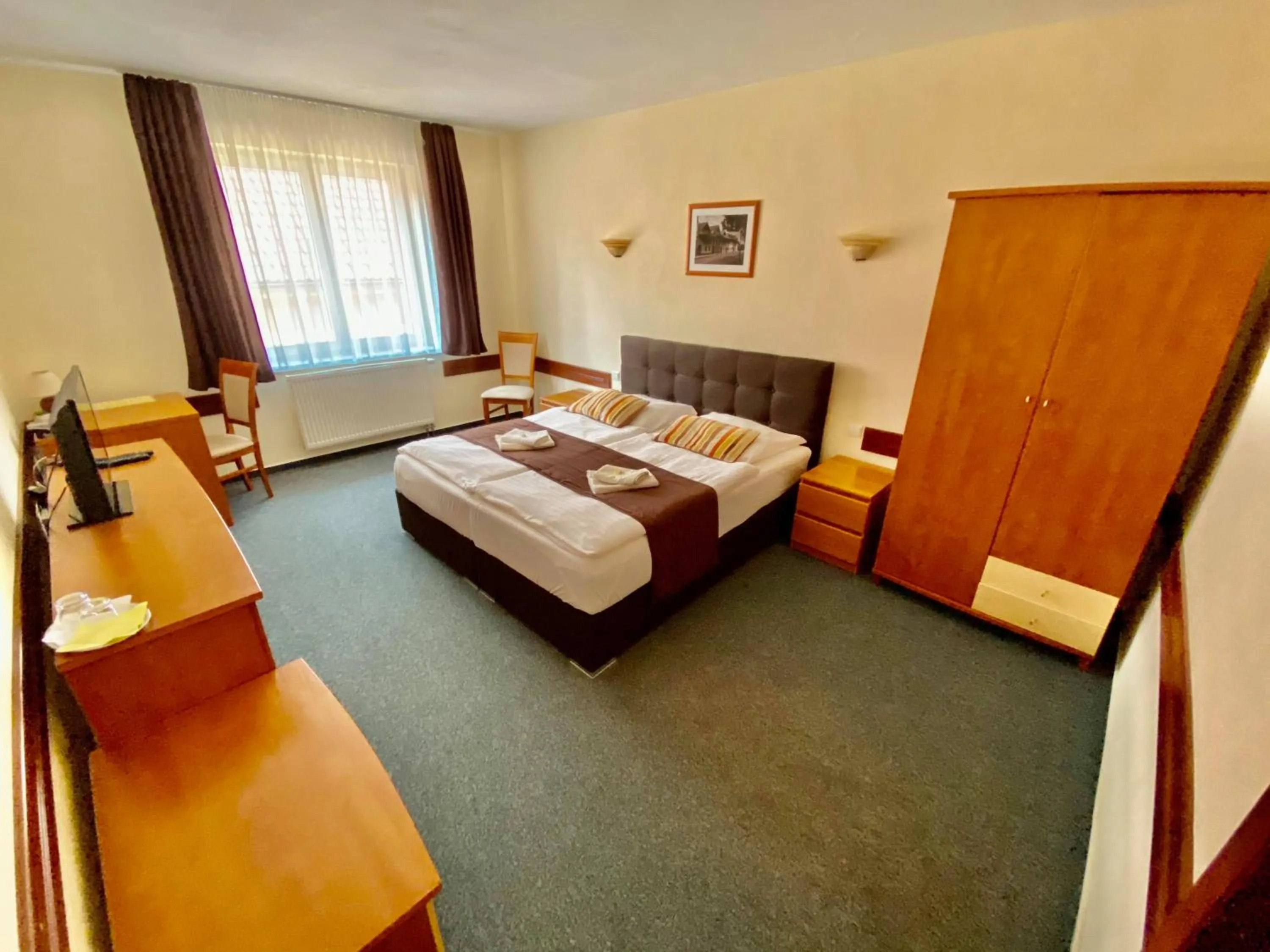 Bed in Garni Hotel Tatramonti