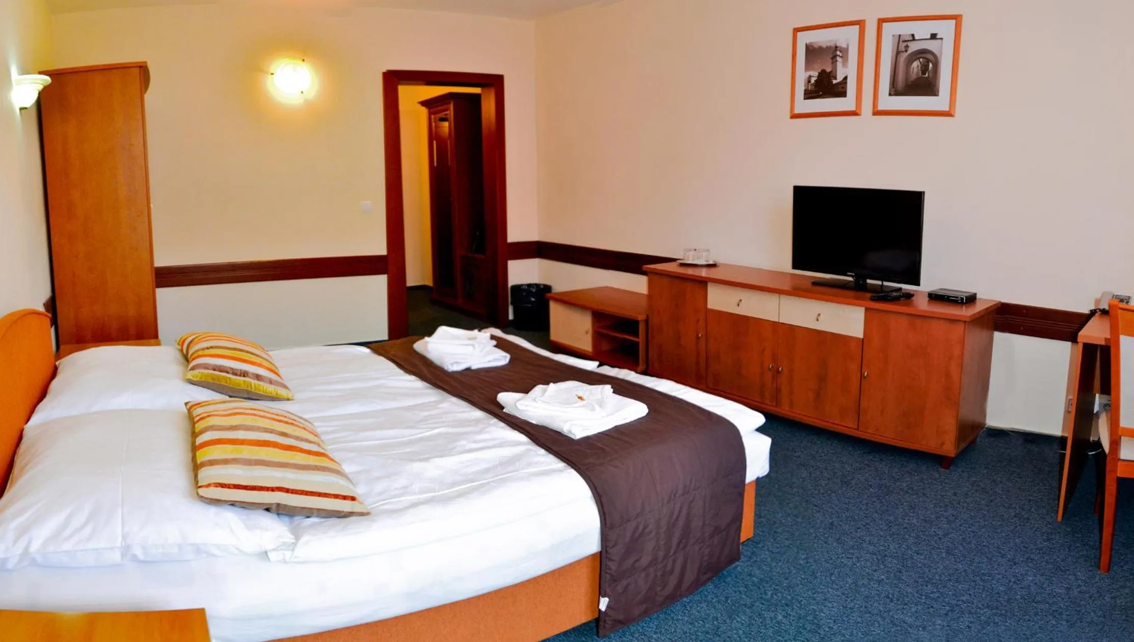 Bed in Garni Hotel Tatramonti
