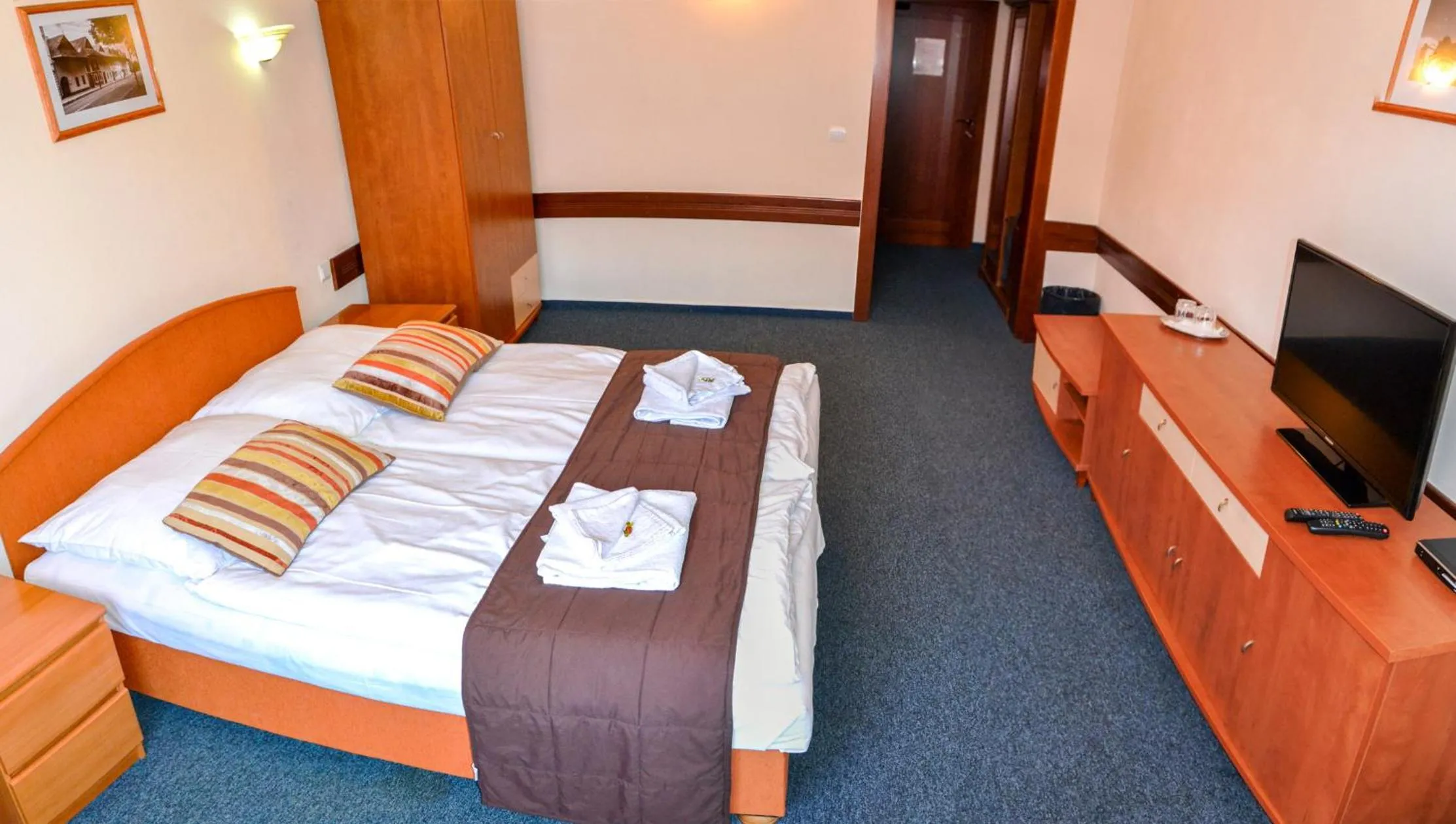 Bed in Garni Hotel Tatramonti