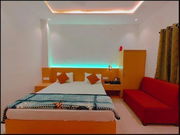 Bed in Hotel Ramay Palace