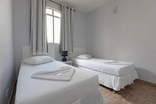 Bed in Iguassu Flats Hotel