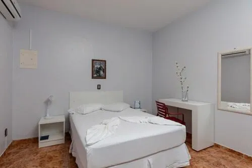 Bed in Iguassu Flats Hotel