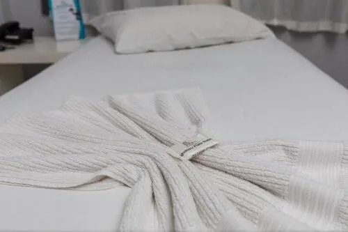 Bed in Iguassu Flats Hotel