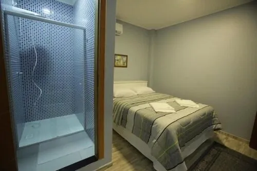 Bed in Iguassu Flats Hotel