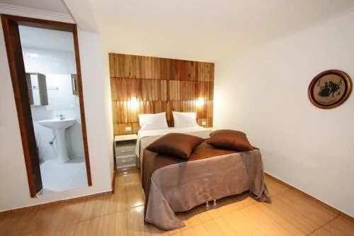 Bed in Iguassu Flats Hotel