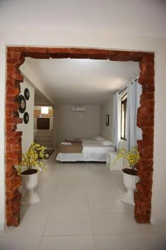 Bed in Iguassu Flats Hotel