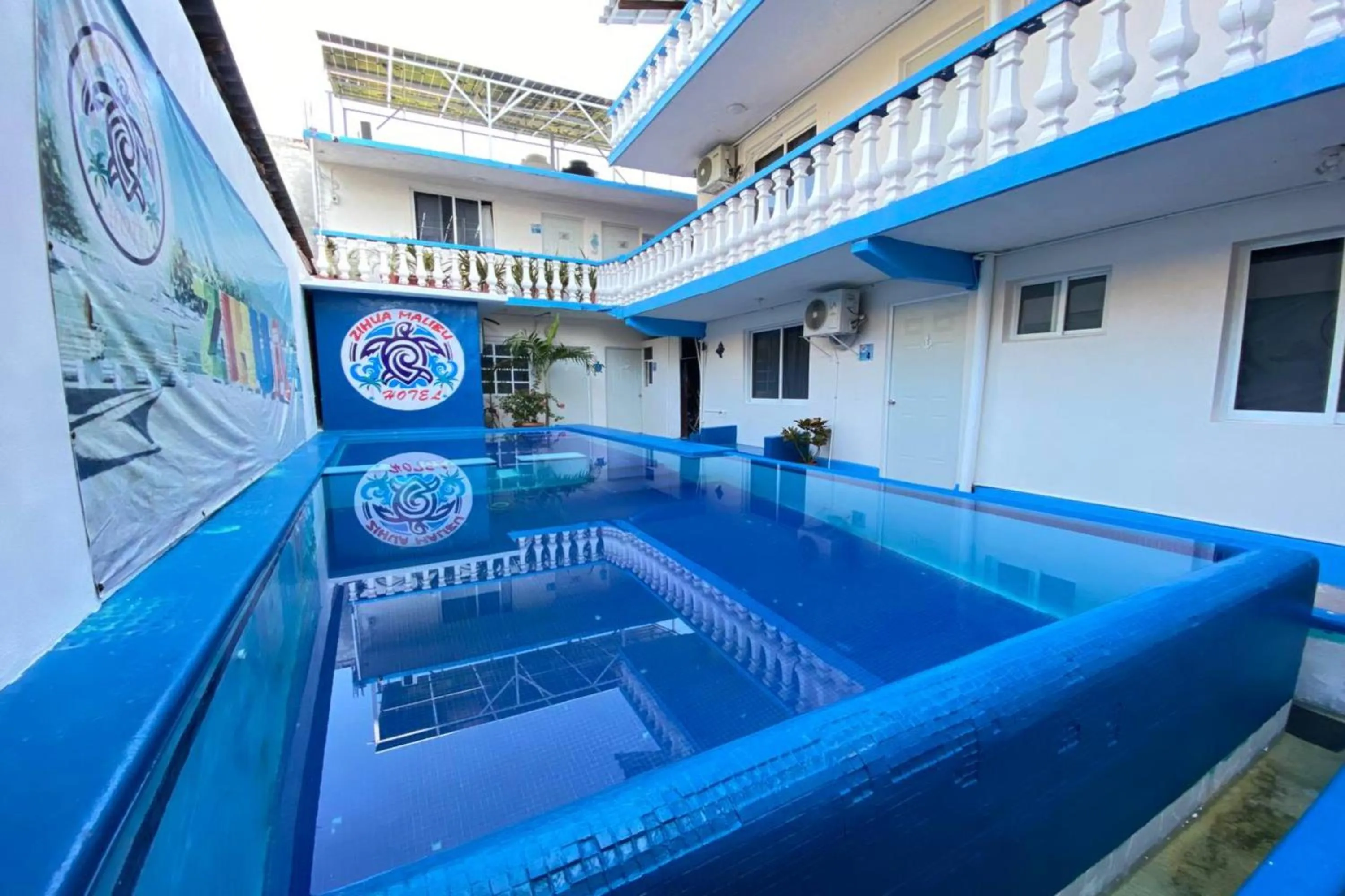 Swimming pool in OYO Hotel Zihuatanejo Malibu