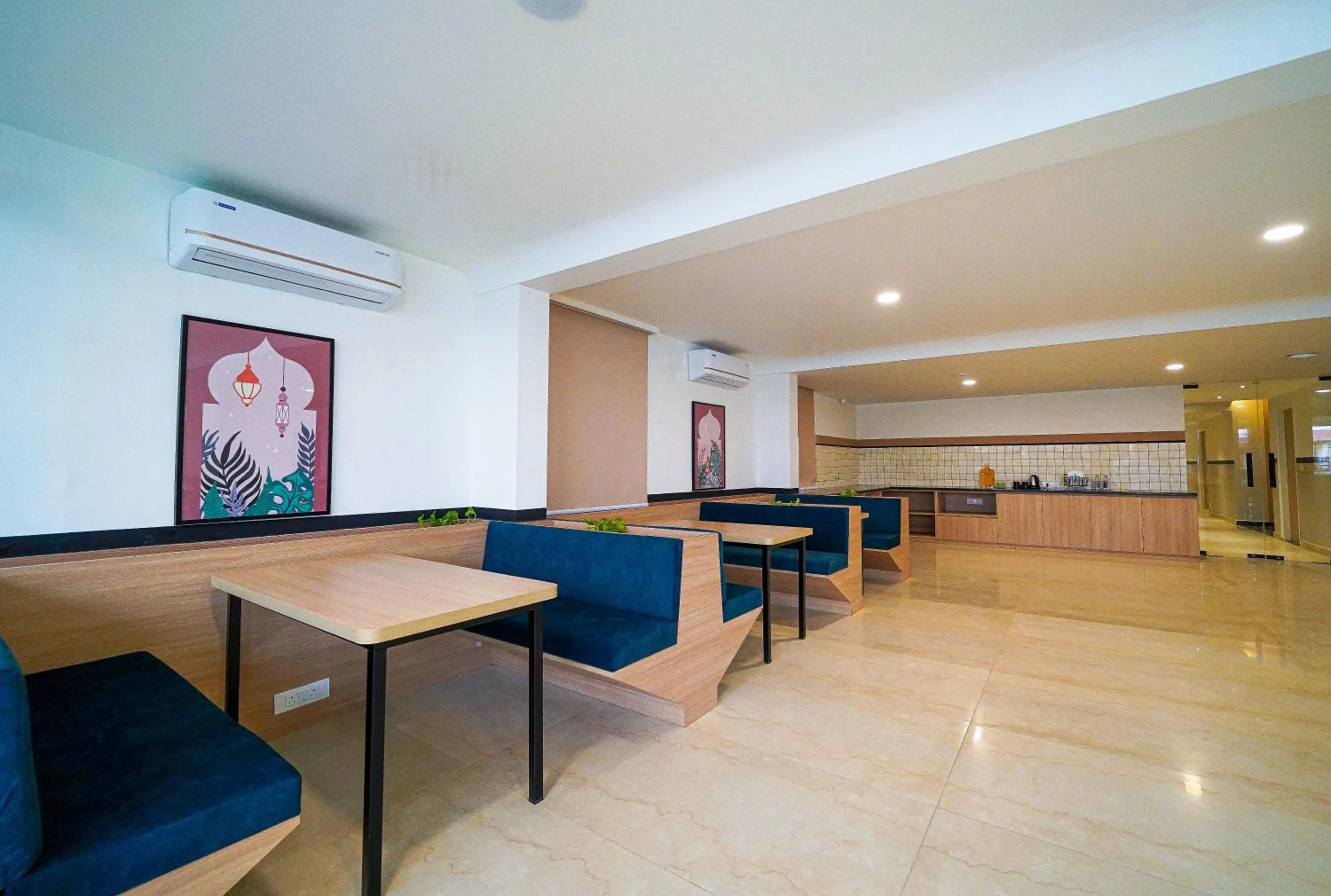 Seating area in Olive Hotel Hoodi by Embassy Group