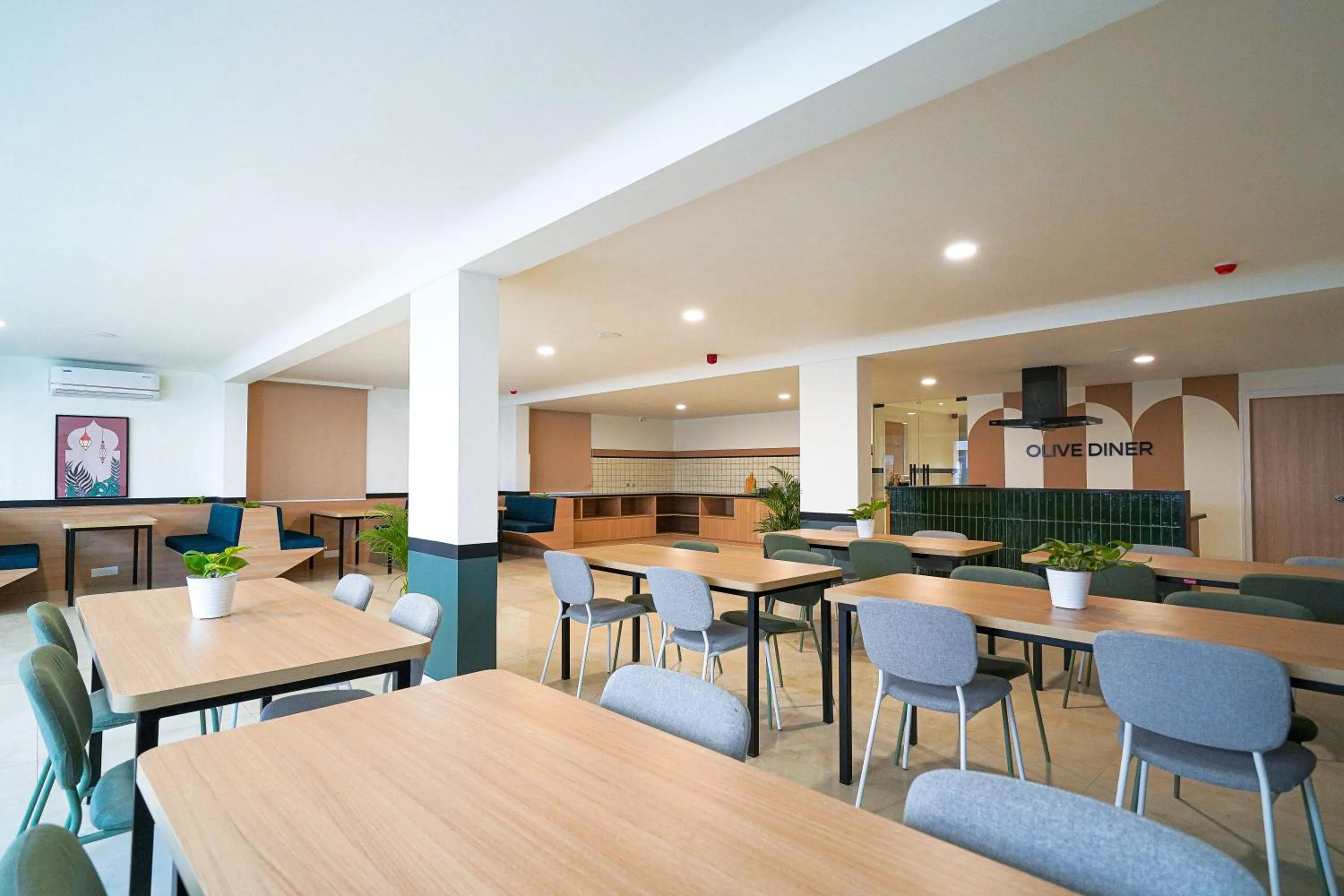 Seating area in Olive Hotel Hoodi by Embassy Group