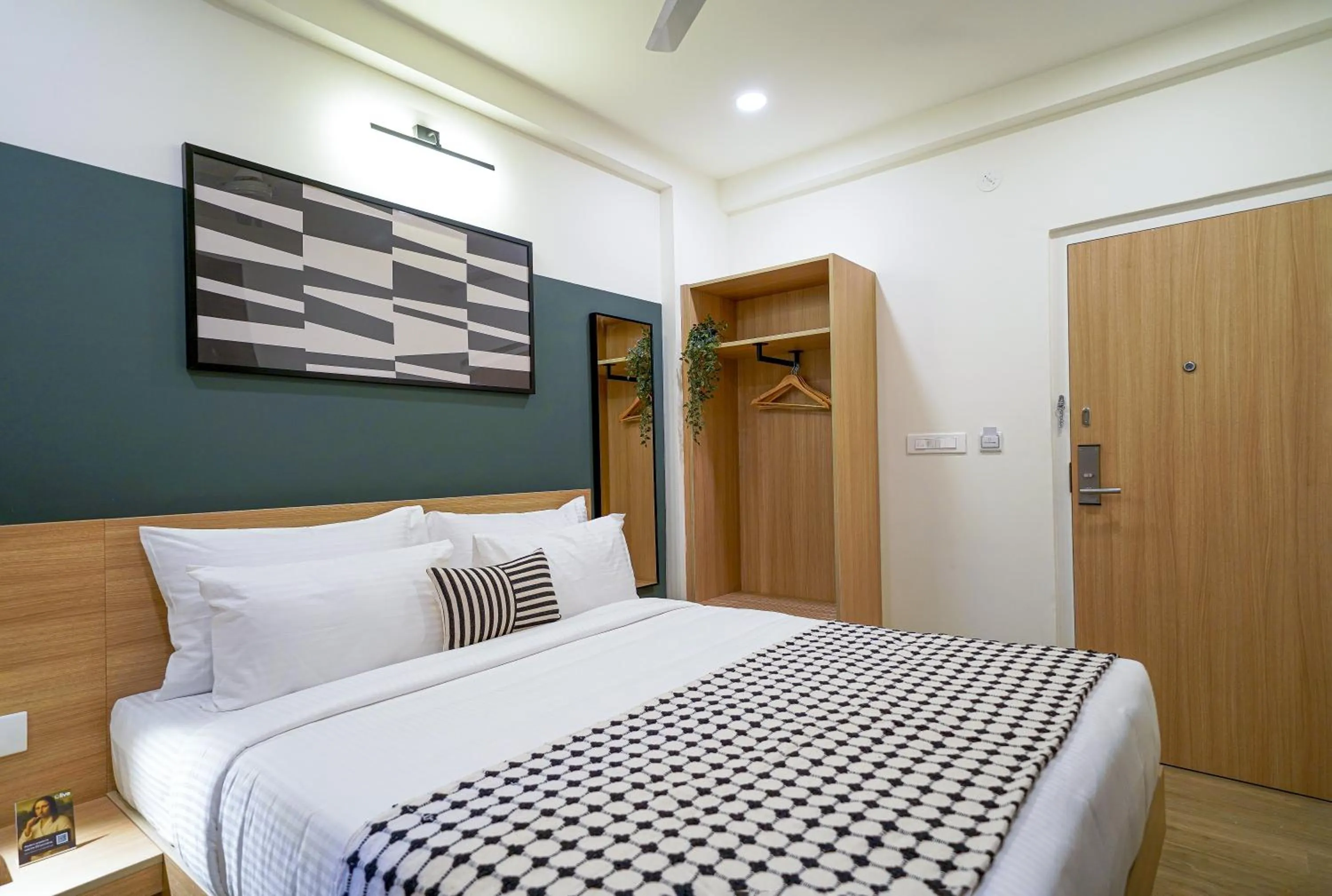 Bed in Olive Hotel Hoodi by Embassy Group