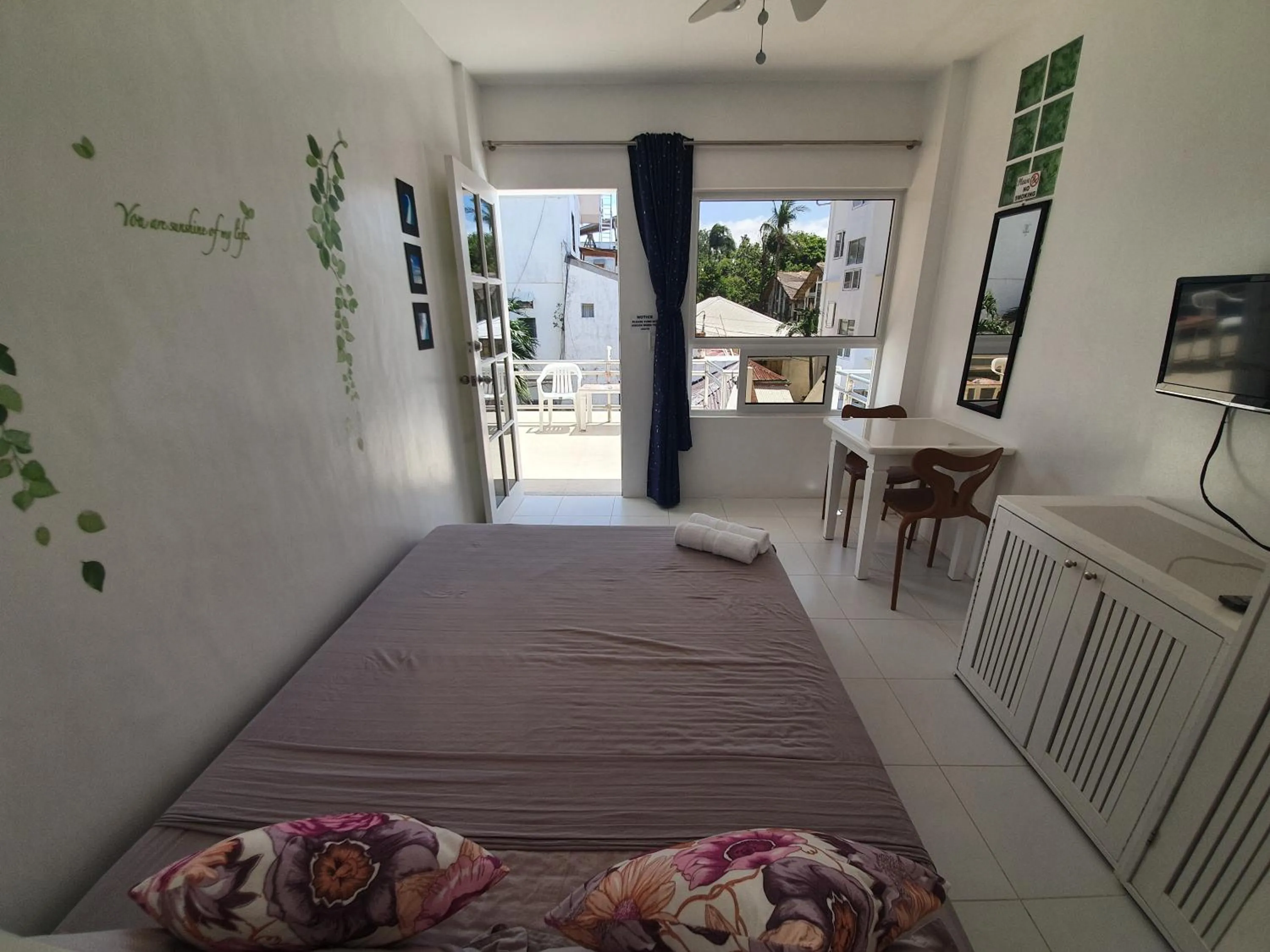 Photo of the whole room, Bed in ClubBoracay Apartelle