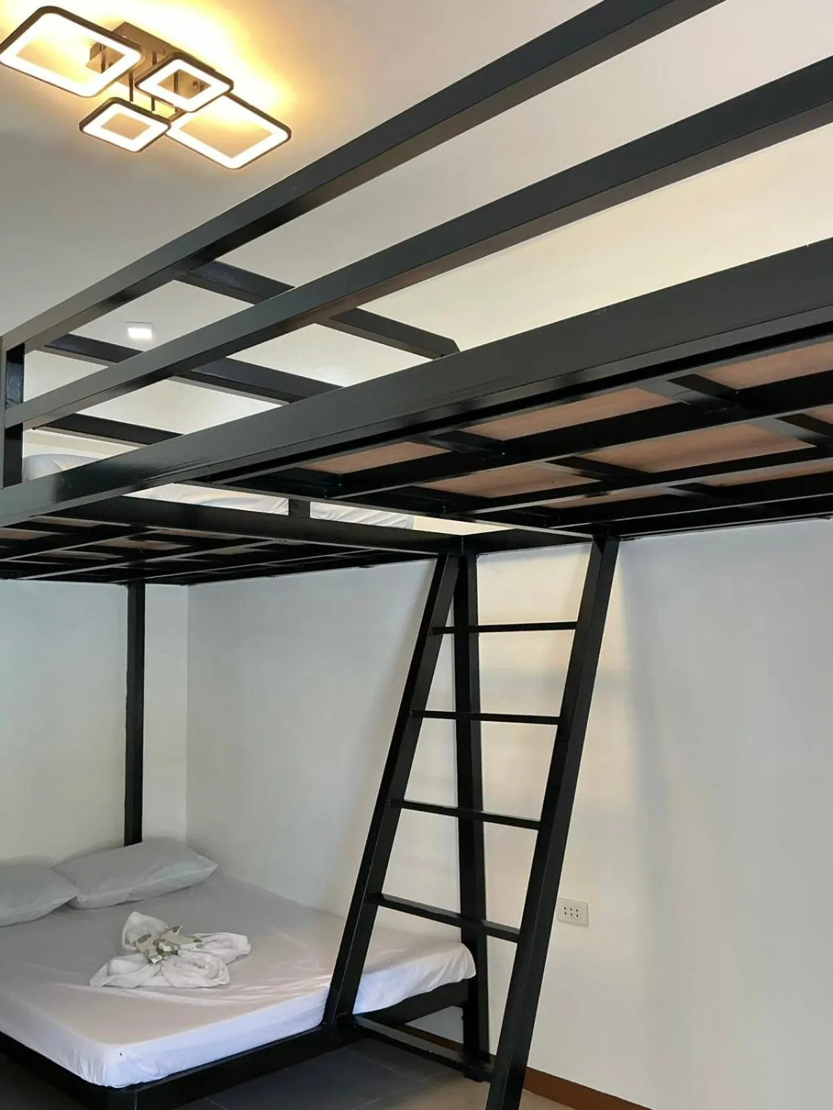 Bed in KNB West Villa Inn by SMS Hospitality