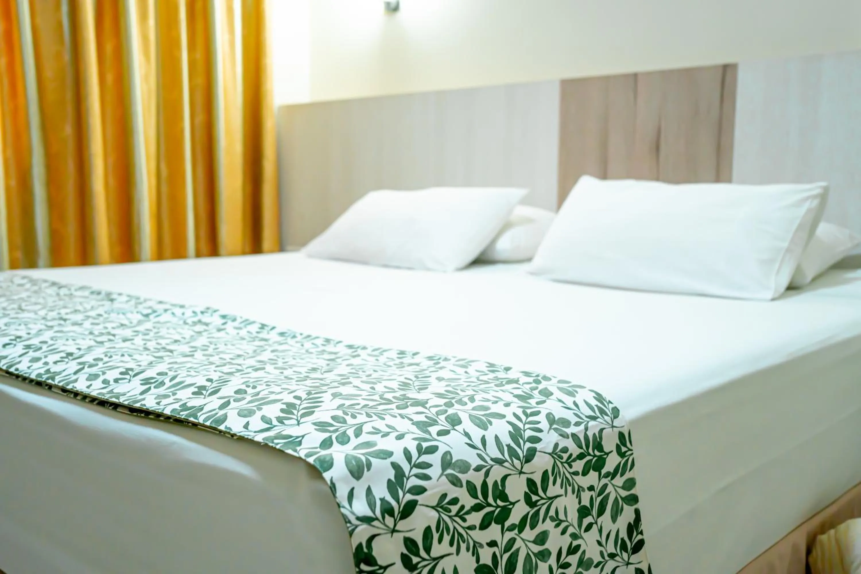 Bed in Megal Suites Hotel