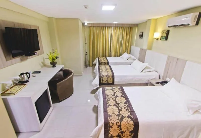 Bed in Megal Suites Hotel