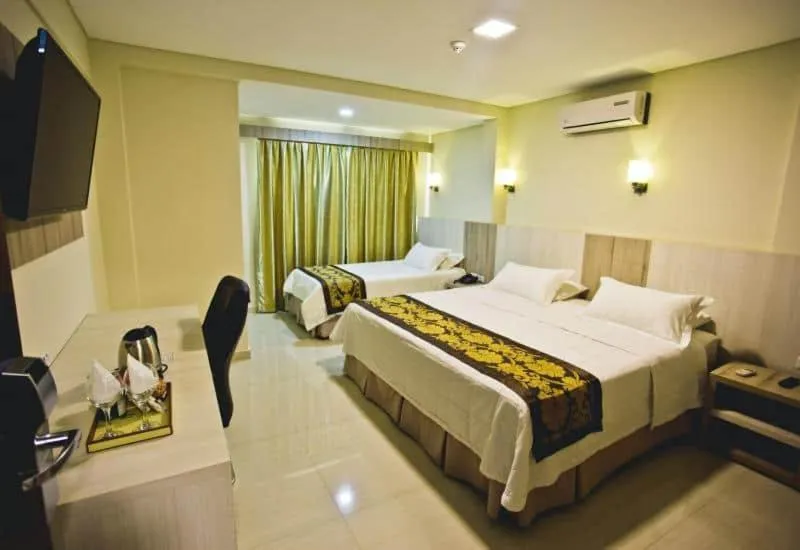 Bed in Megal Suites Hotel