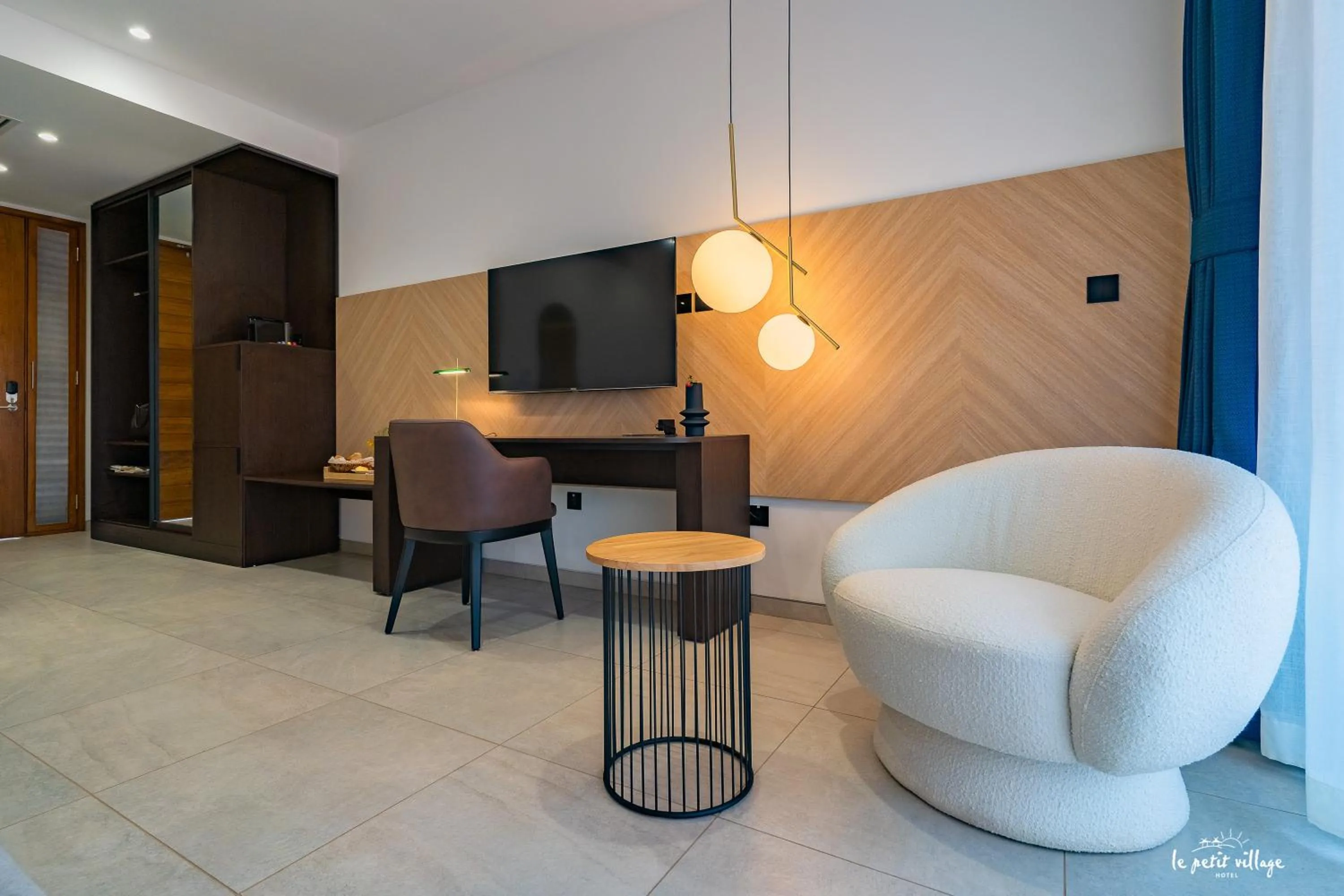 Bed in Le Petit Village Boutique Hotel & Spa